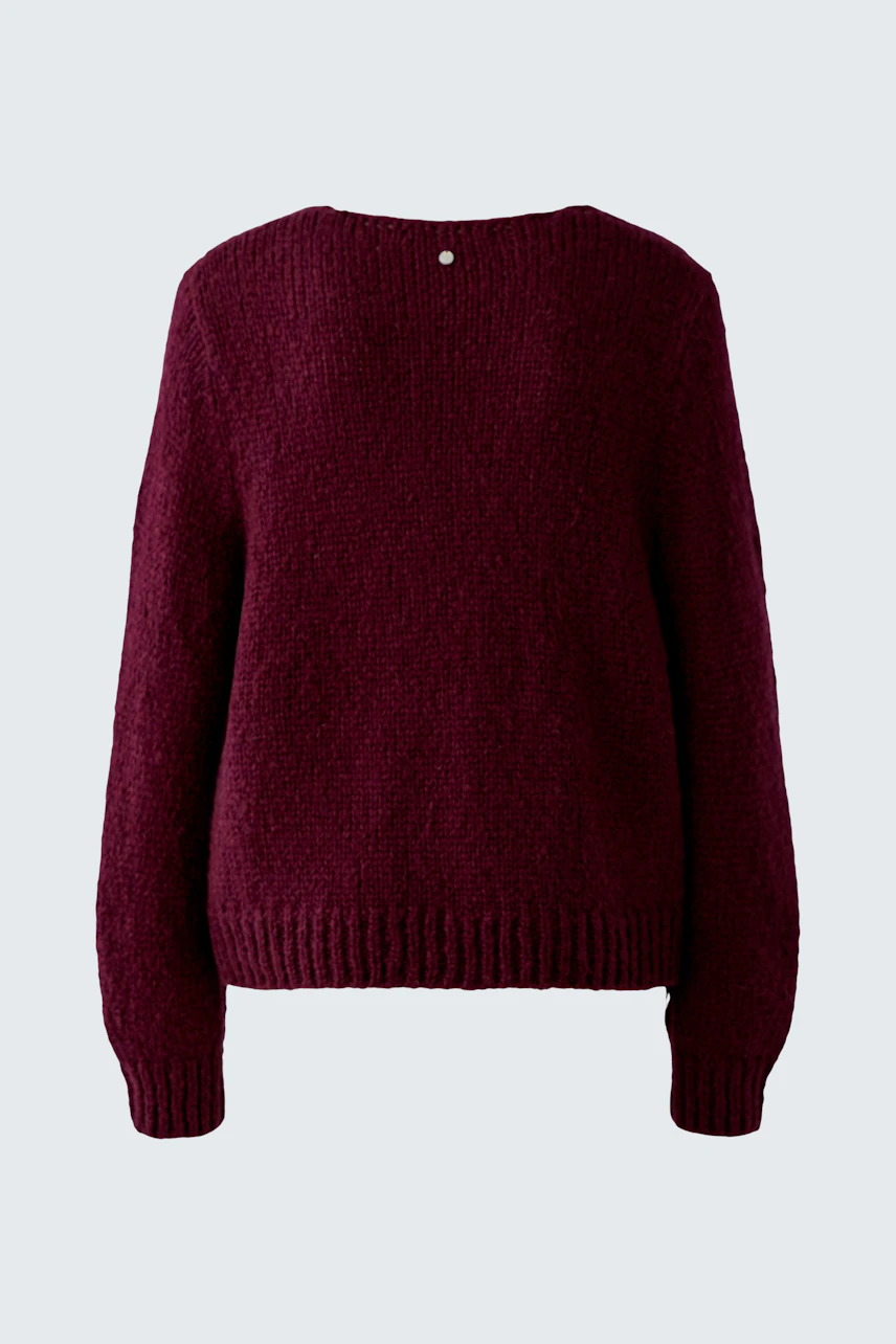 Cozy women's pullover in deep burgundy with a relaxed fit and ribbed hem.