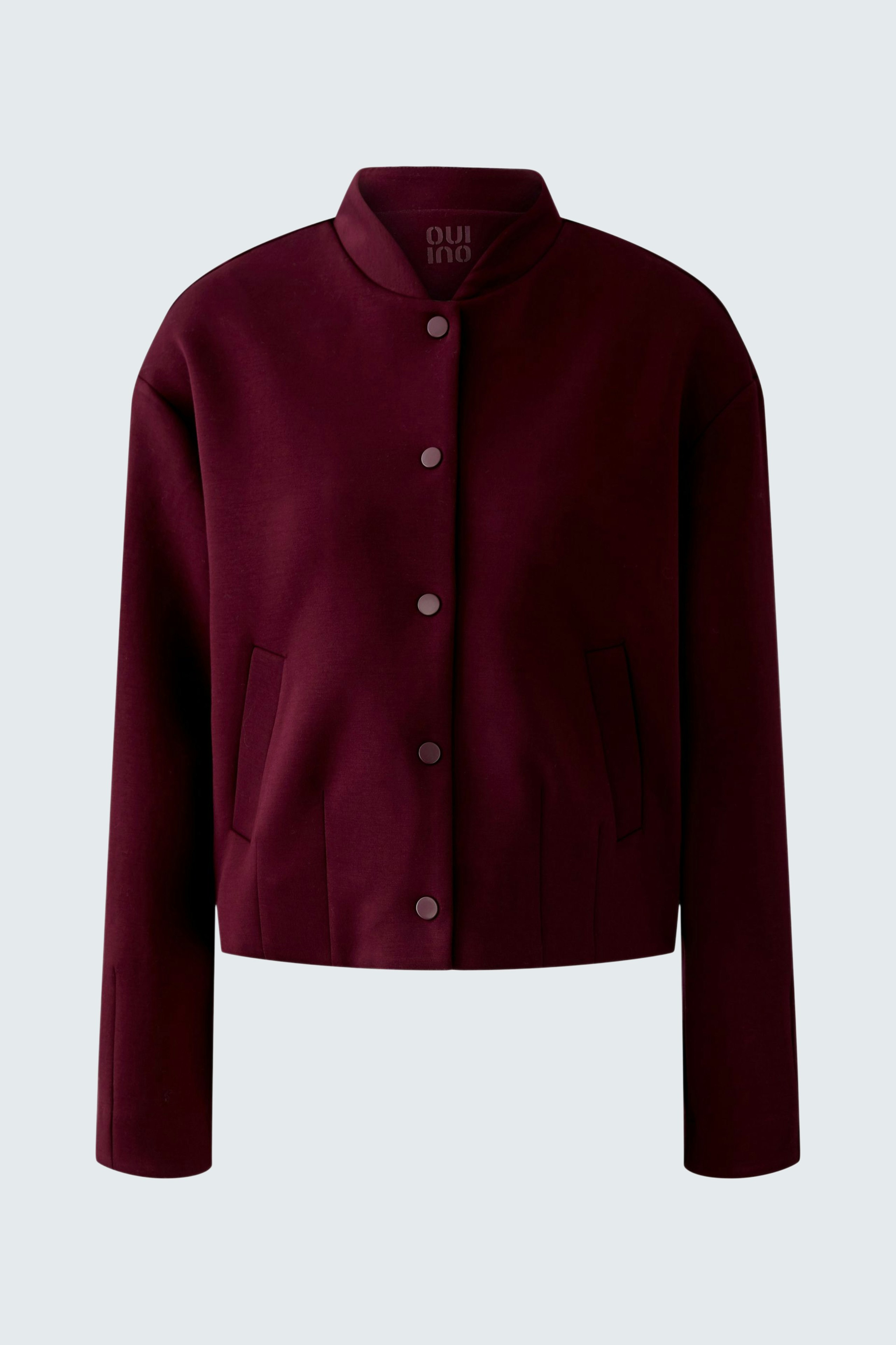 Casual women's blouson: A burgundy jacket with a button-up front and side pockets.
