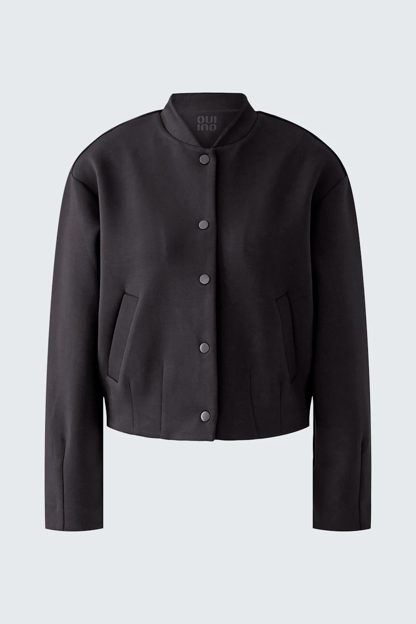 Modern women's blouson: Black cropped jacket with button closure and side pockets.