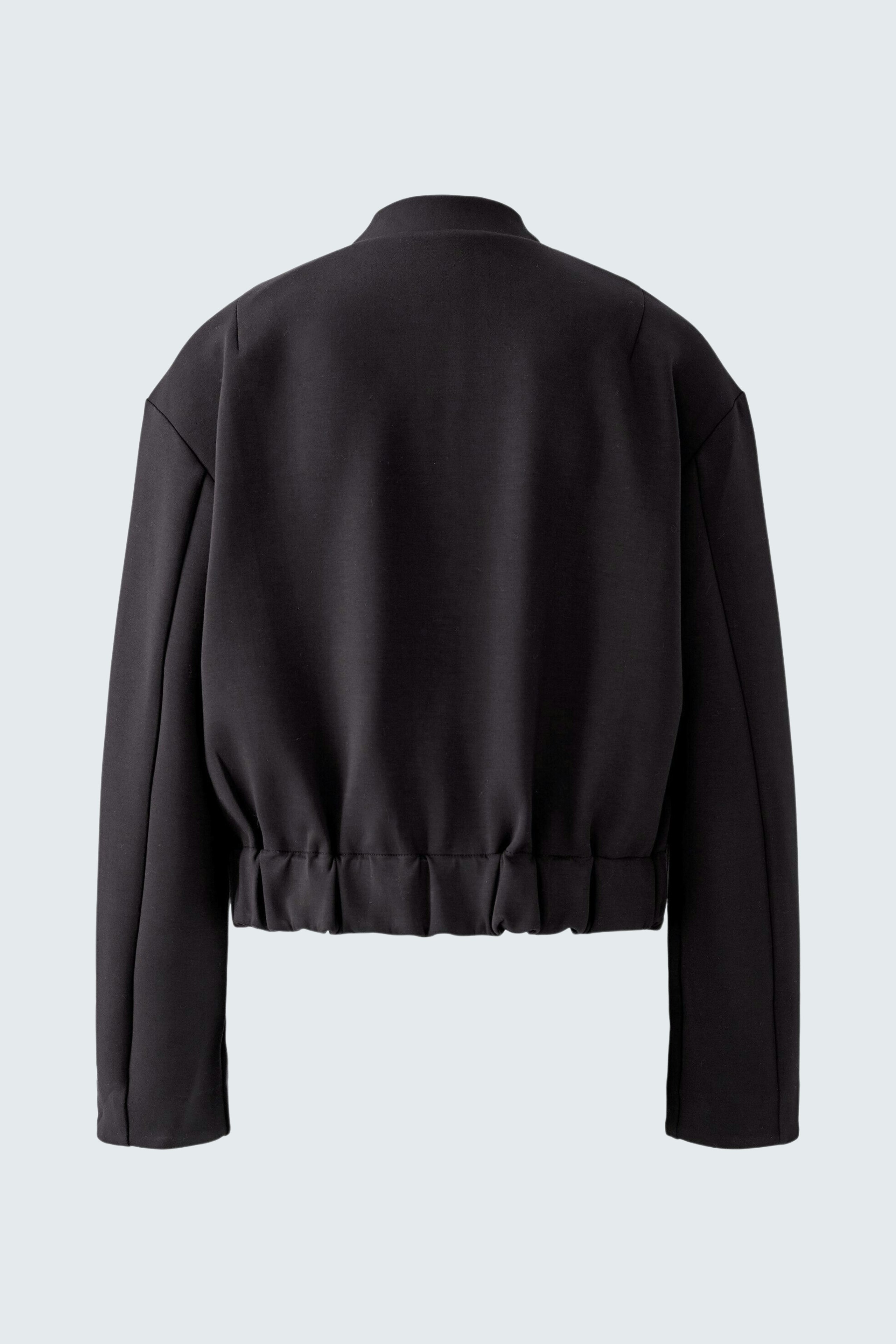 Casual women's jacket: Black cropped jacket with a relaxed fit and elastic hem.