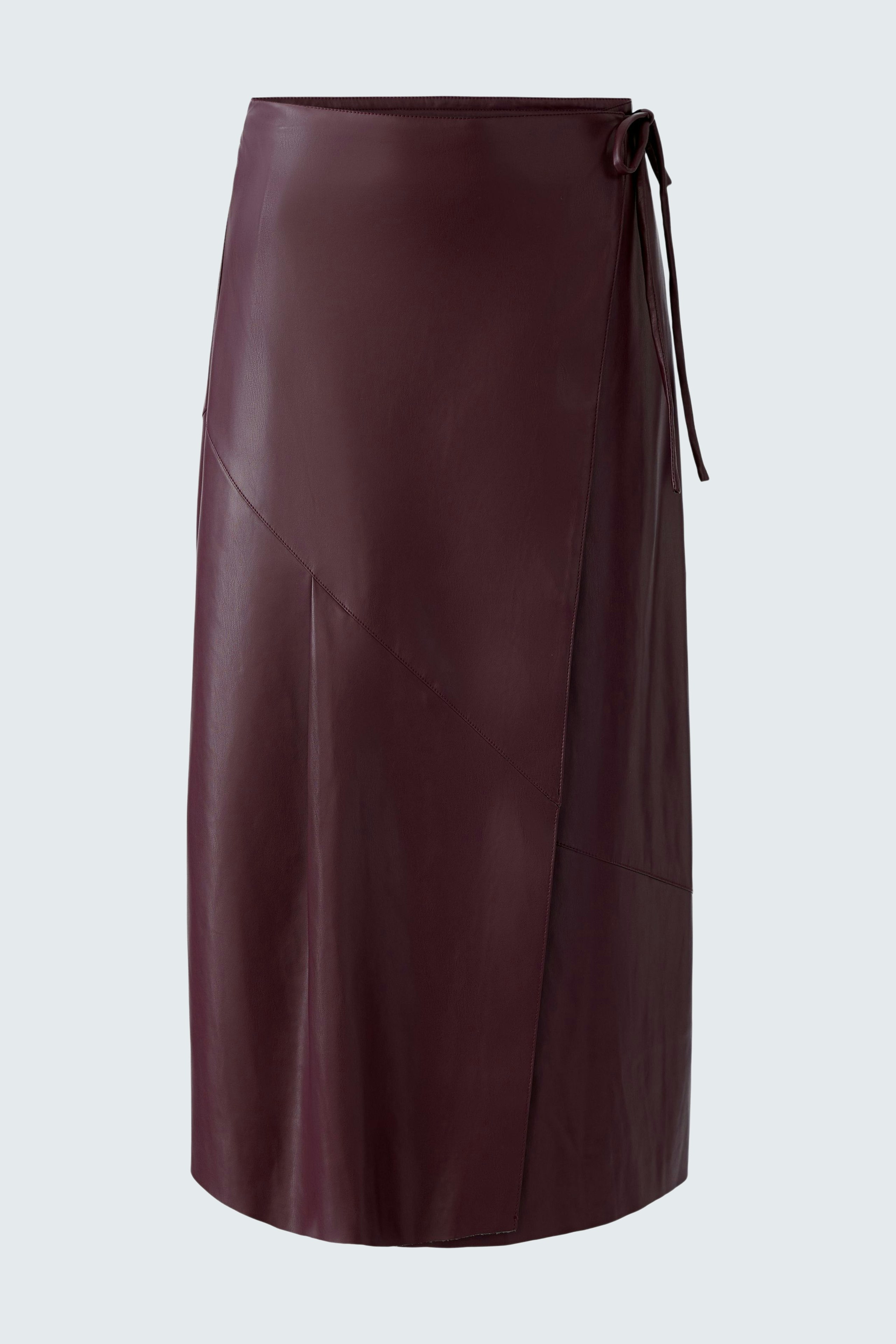 Stylish wrap skirt: A woman in a burgundy wrap skirt with a modern design, perfect for casual wear.