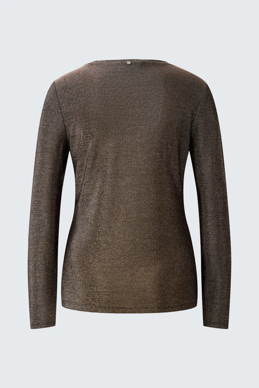 Casual long-sleeve shirt: A woman in a brown long-sleeve shirt with a simple design, showcasing a relaxed fit.