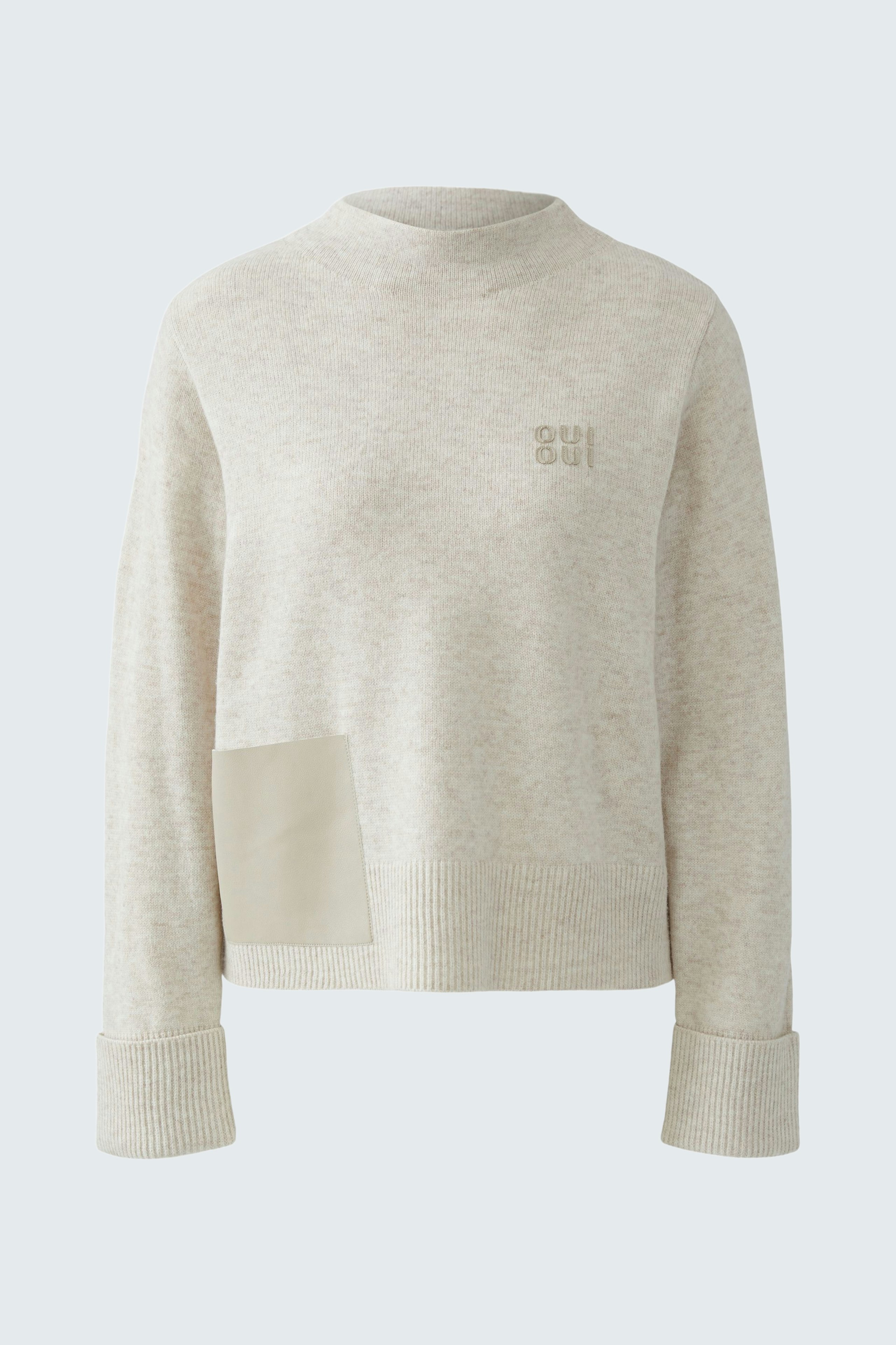 Casual women's pullover in light beige with a unique patch detail and a relaxed fit.
