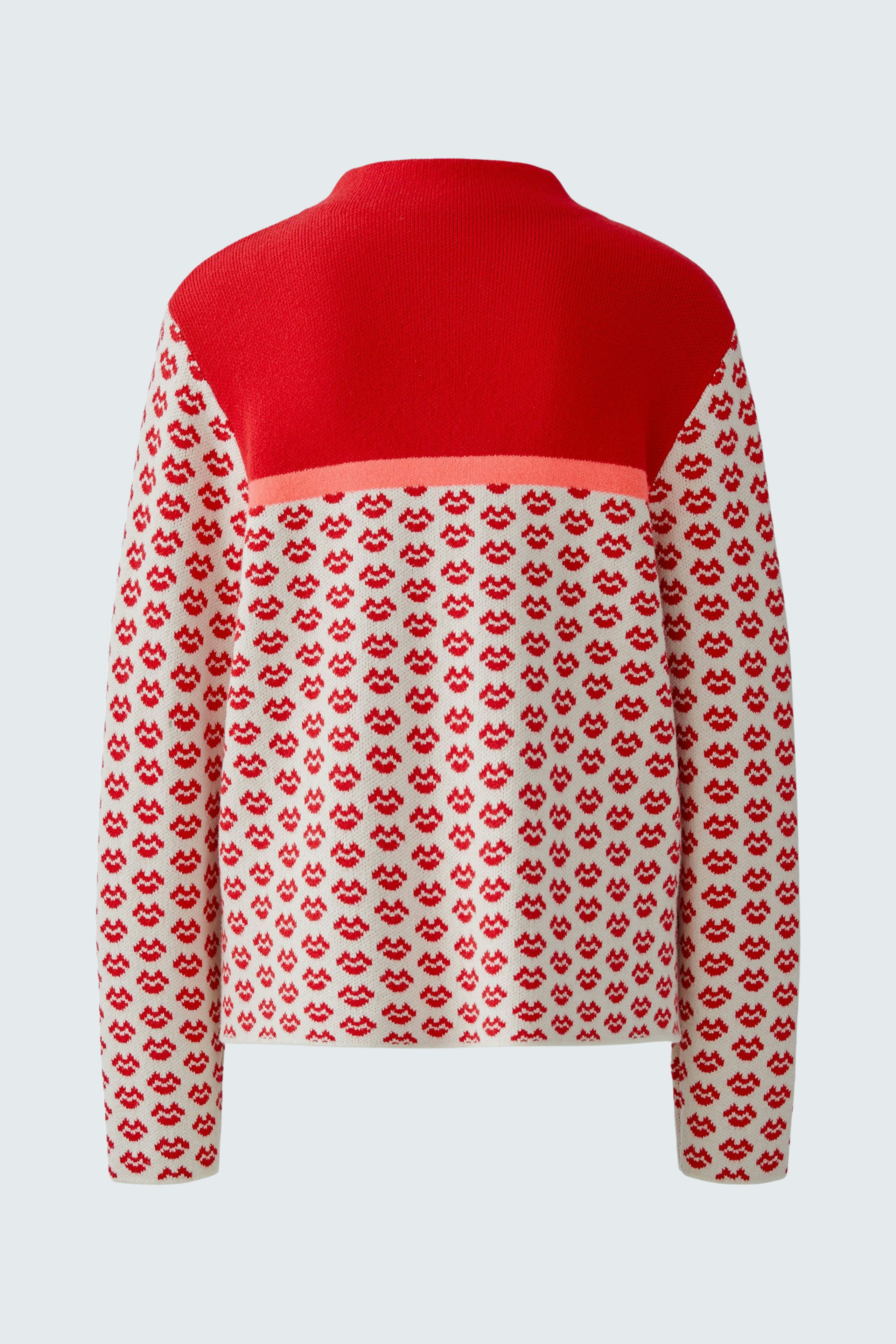 Casual women's pullover: A vibrant red and patterned pullover with a relaxed fit.