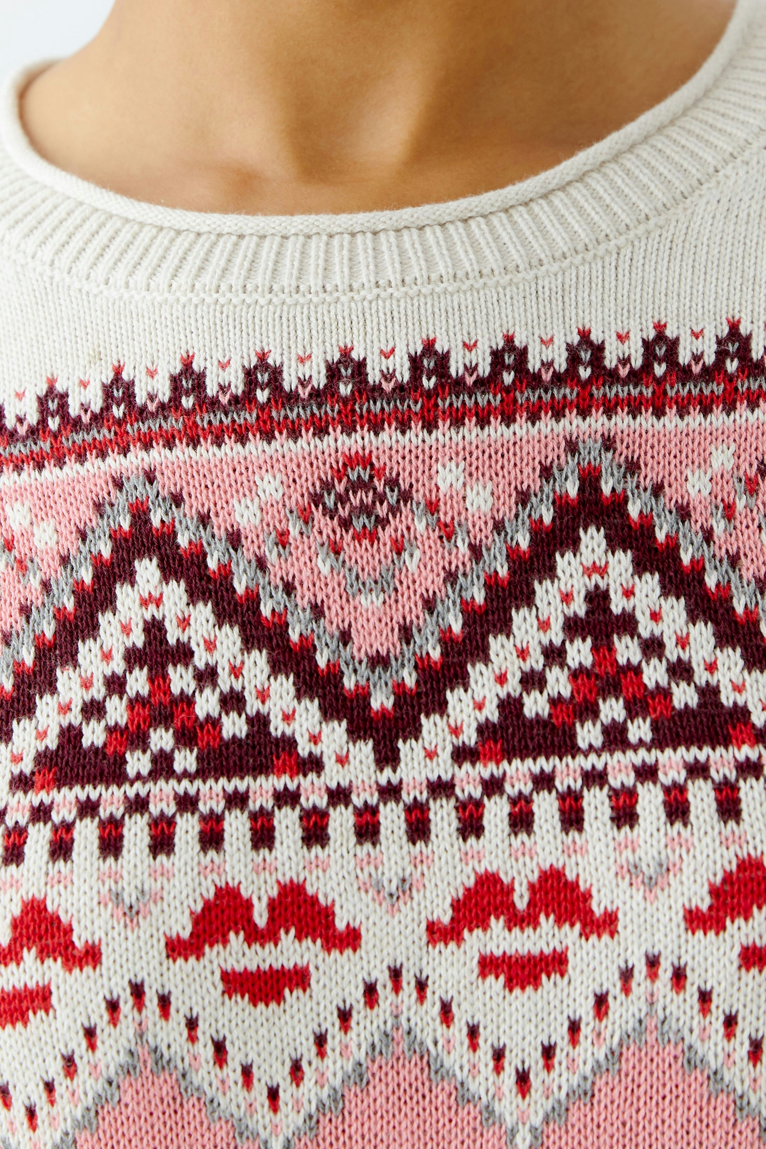 Cozy women's pullover with a colorful geometric pattern, perfect for casual wear.