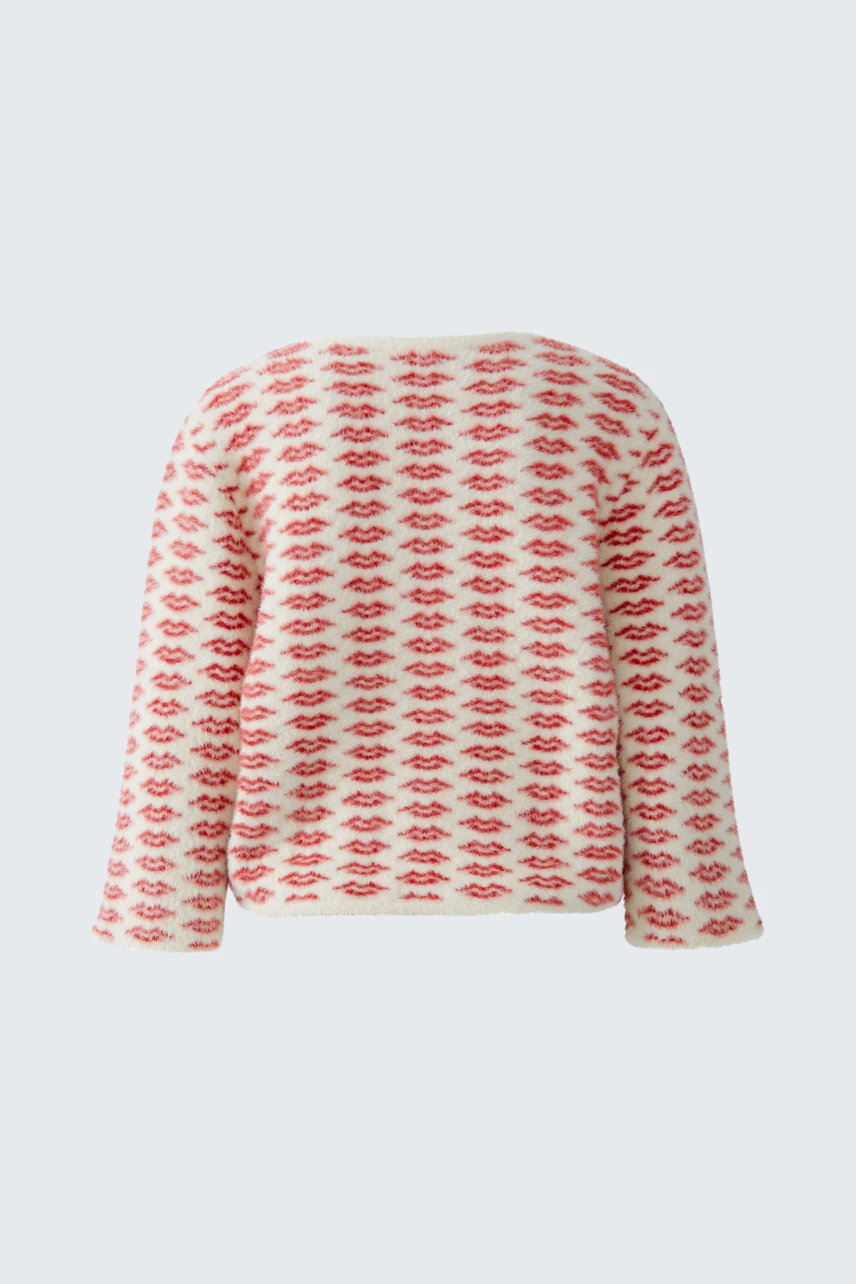 Casual women's pullover: A relaxed fit pullover with a playful red lip pattern on a light background.