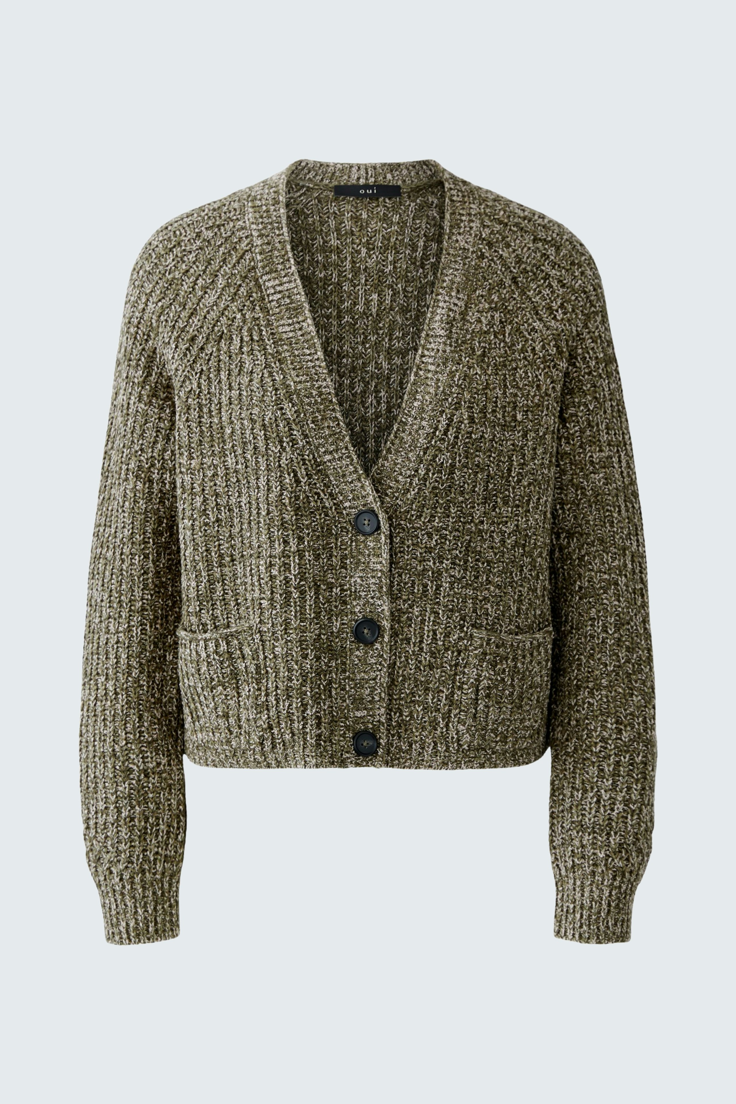 Casual women's cardigan: A woman in a cozy, textured green cardigan with buttons and pockets.