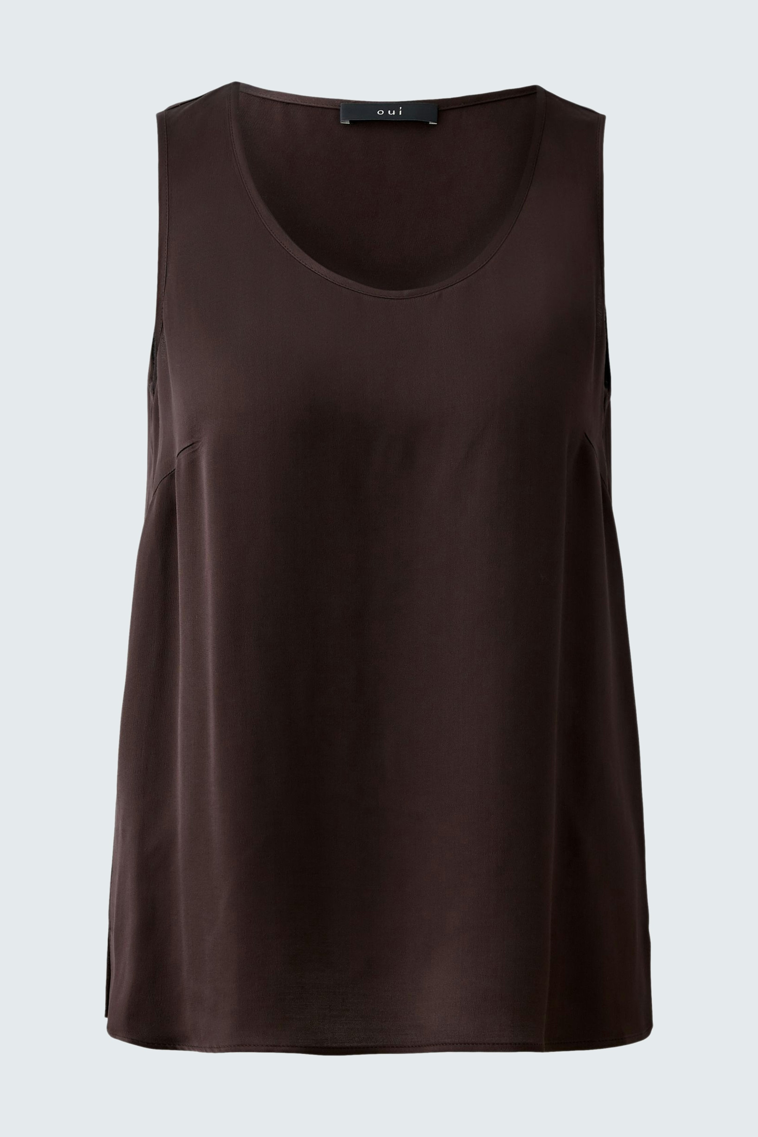 Casual women's top: A woman in a dark brown sleeveless top, perfect for warm days.