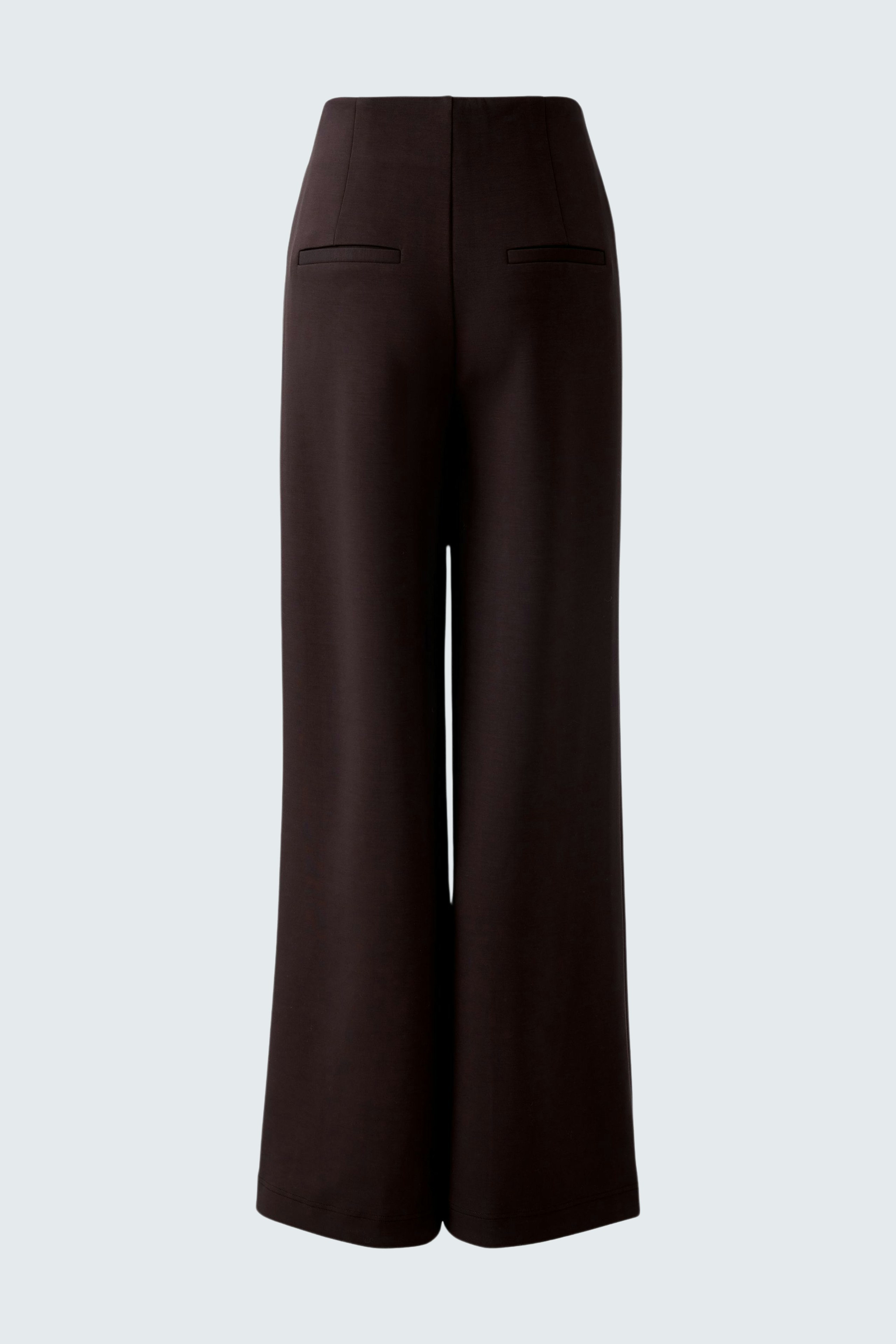 Wide-leg trousers: A woman wearing dark brown wide-leg trousers with a high waist and pockets.