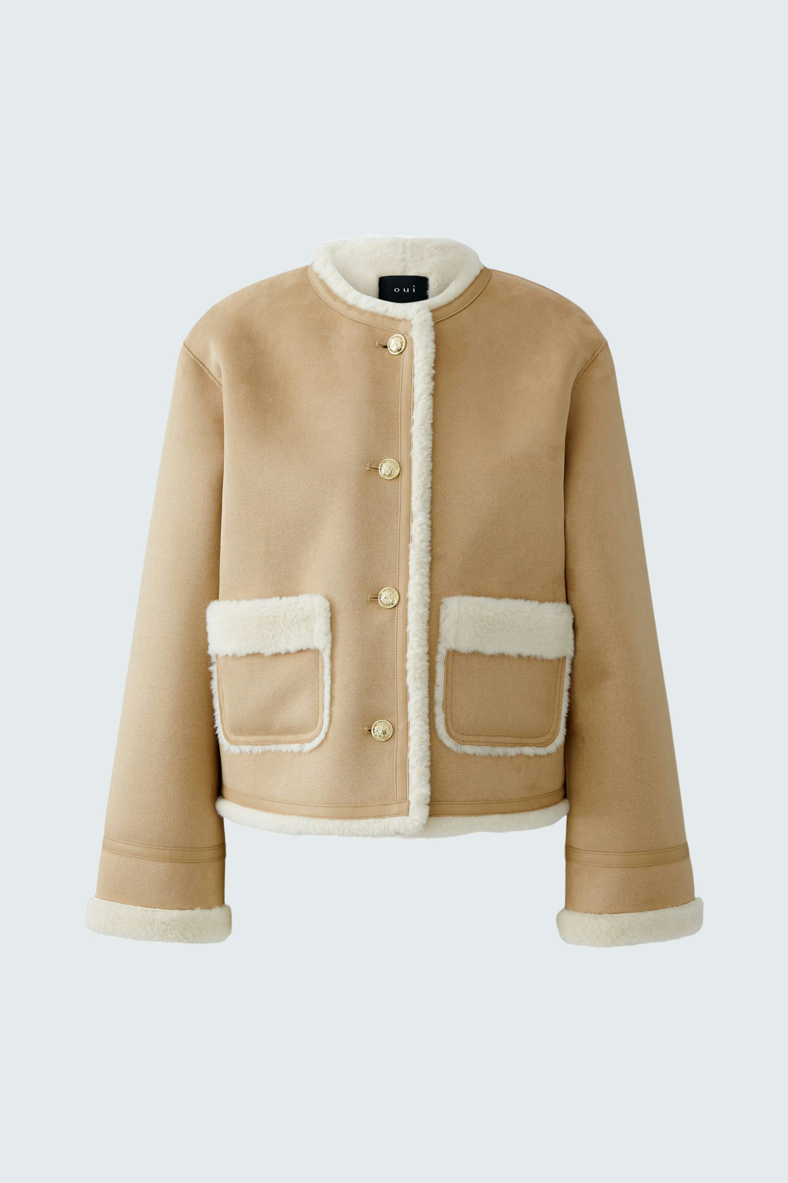 Stylish women's faux leather jacket in beige with soft lining and pockets.