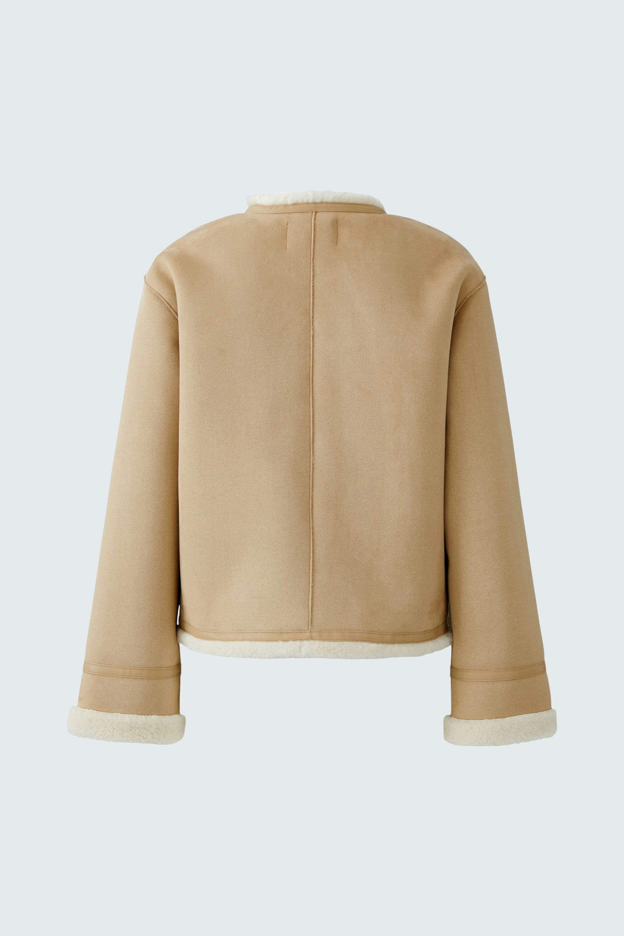 Stylish women's faux leather jacket in beige with a cozy lining, perfect for casual outfits.