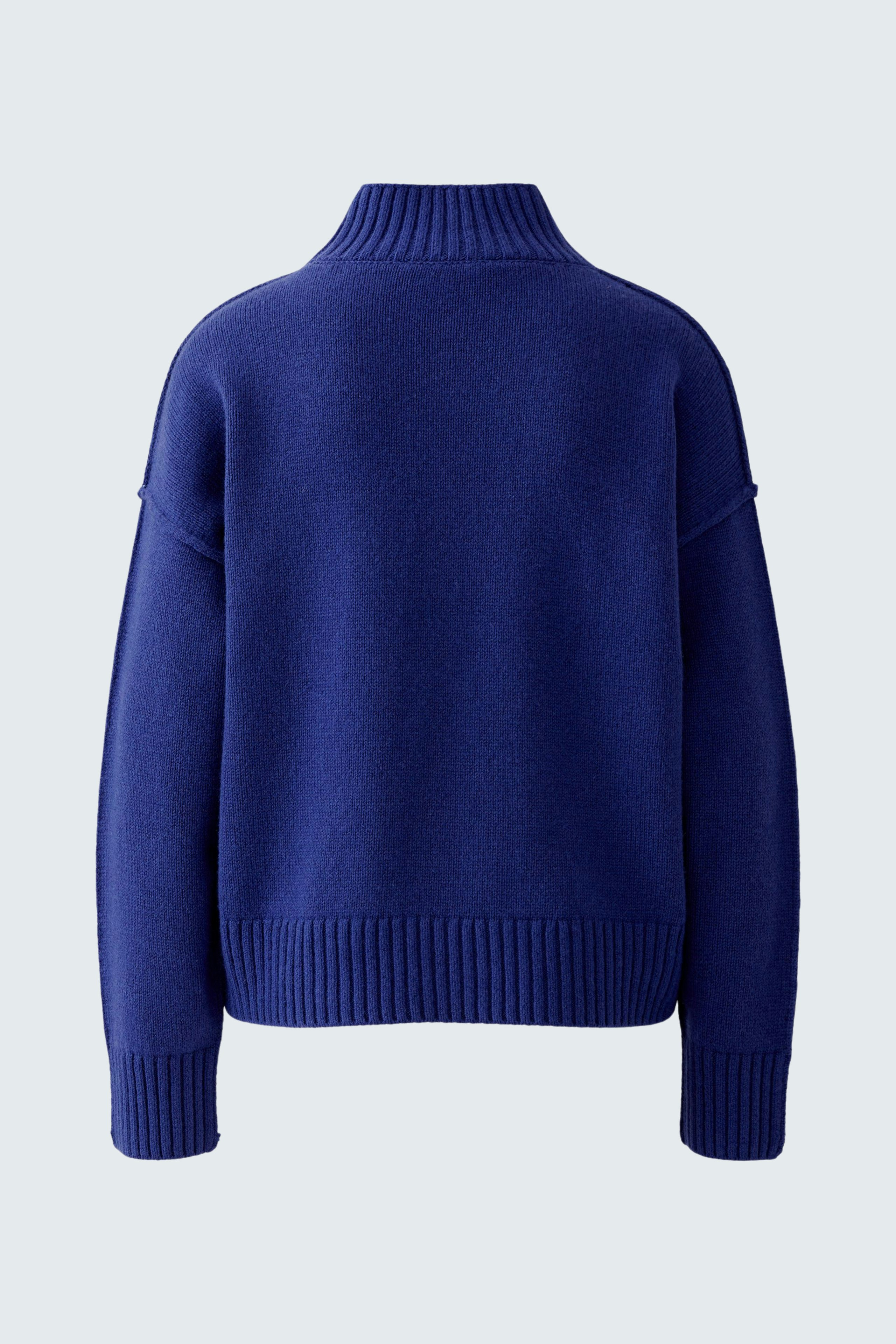 Cozy women's pullover in deep blue with a relaxed fit and high collar, perfect for casual wear.