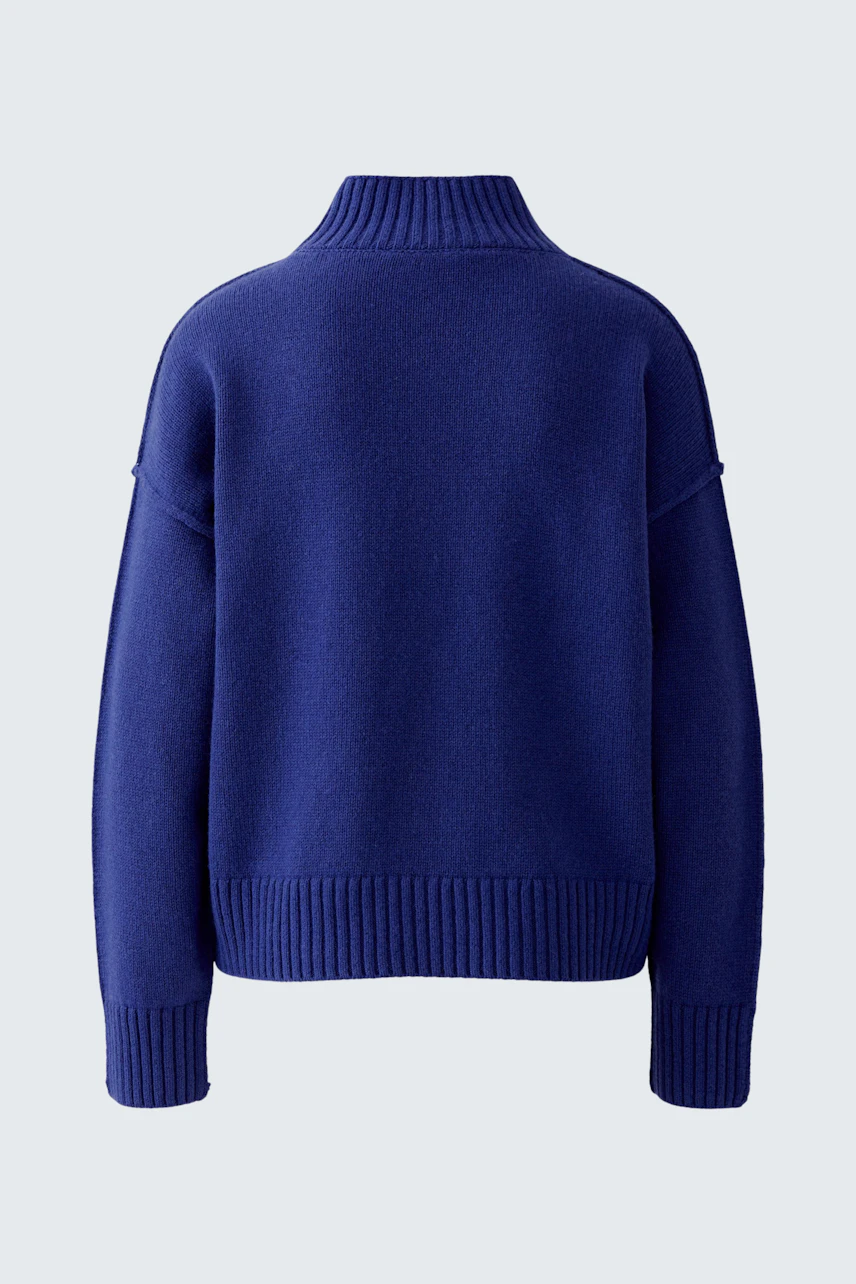 Cozy women's pullover in deep blue with a relaxed fit and high collar, perfect for casual wear.