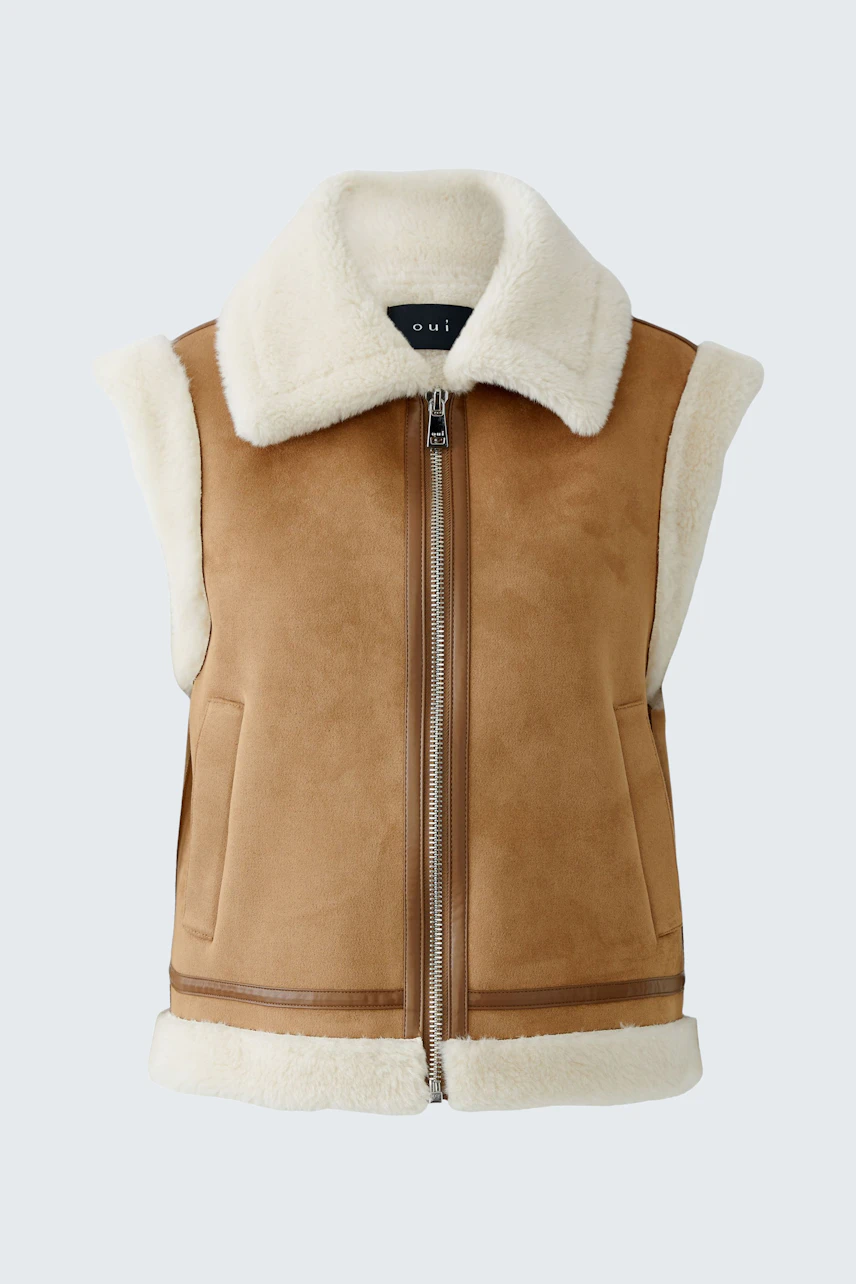 Casual women's vest: A stylish brown vest with a soft collar and zip, perfect for layering.