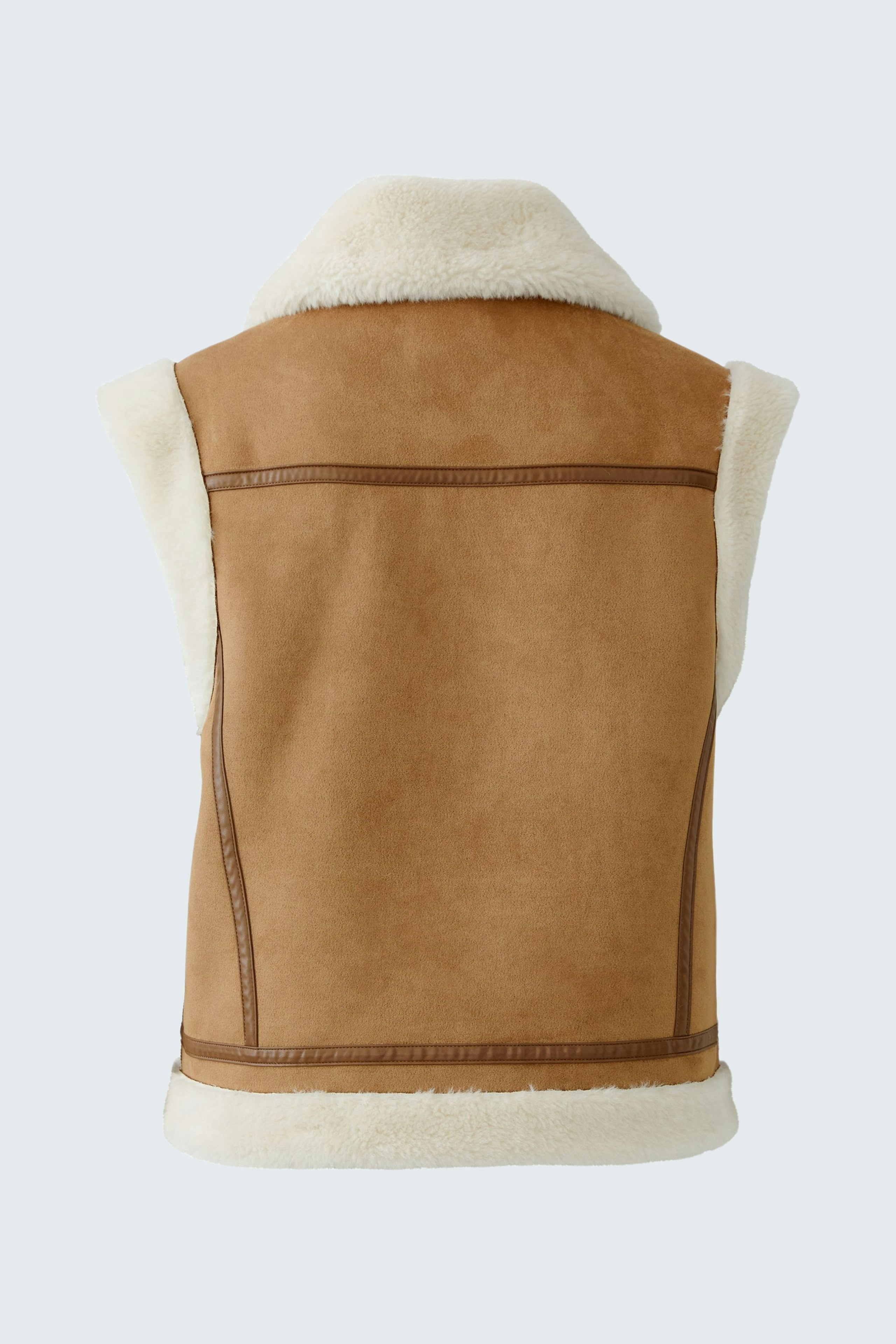 Casual women's vest: A brown sleeveless vest with a soft white collar, perfect for layering.