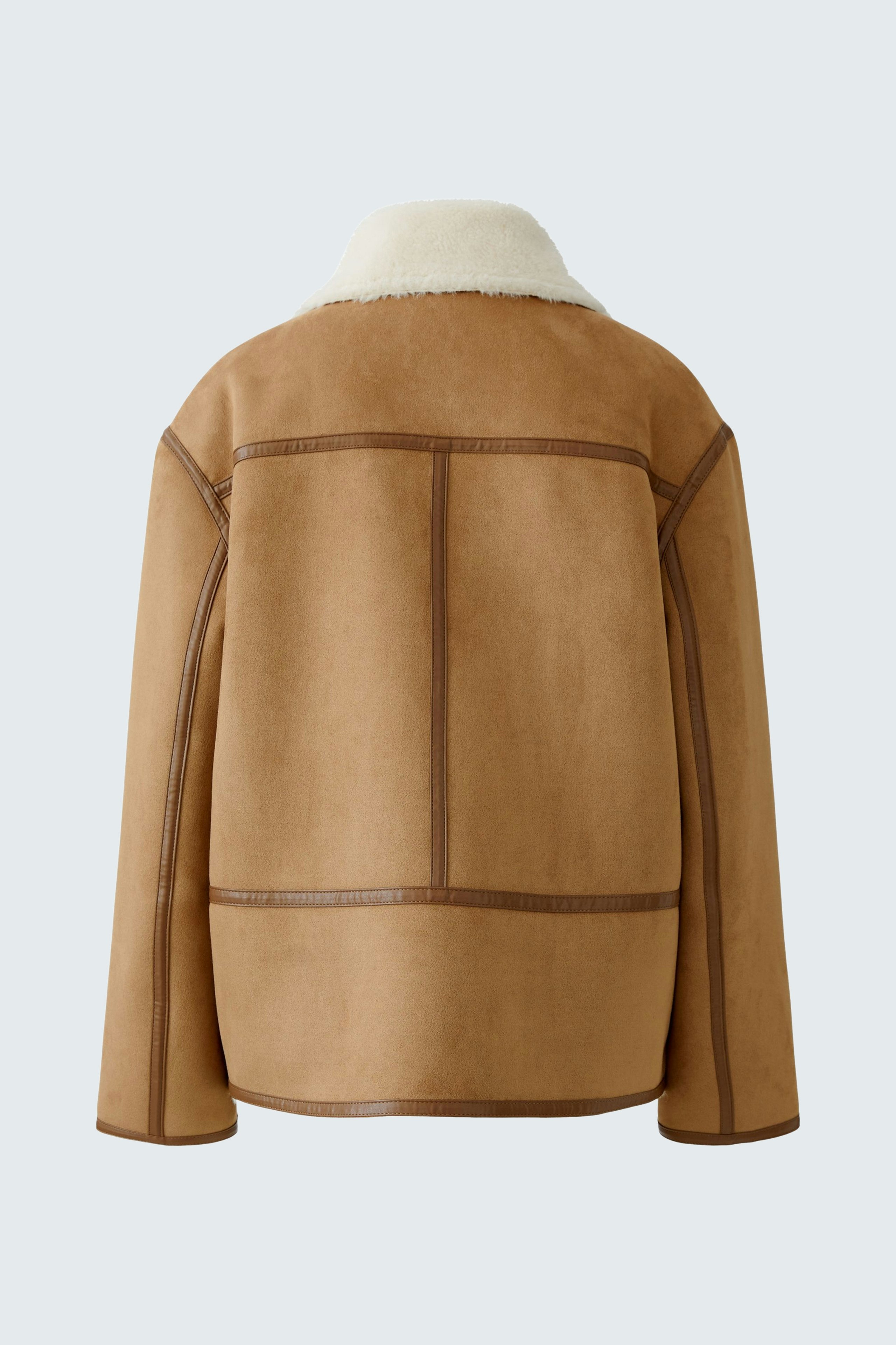 Casual women's outdoor jacket: Back view of a brown jacket with a soft collar and stylish seams.