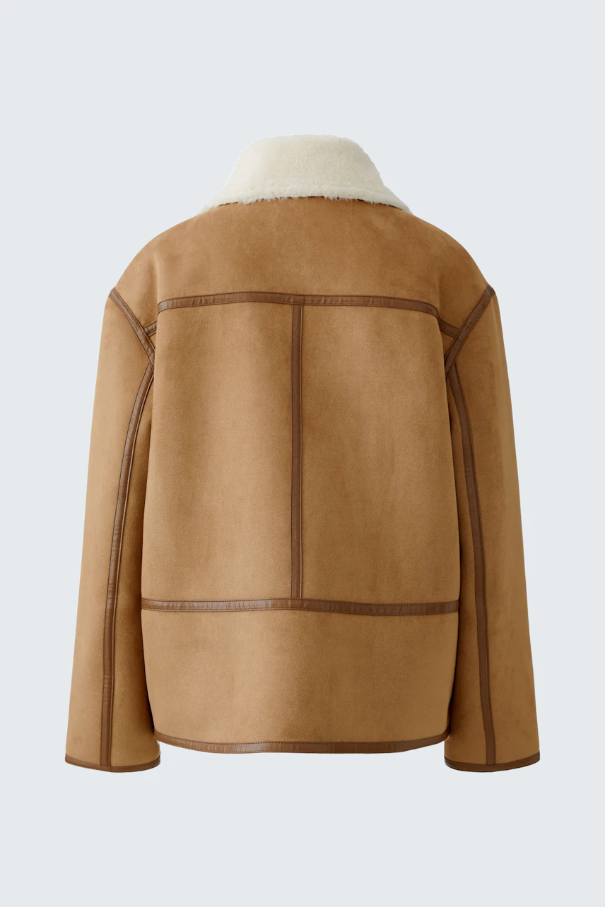 Casual women's outdoor jacket: Back view of a brown jacket with a soft collar and stylish seams.