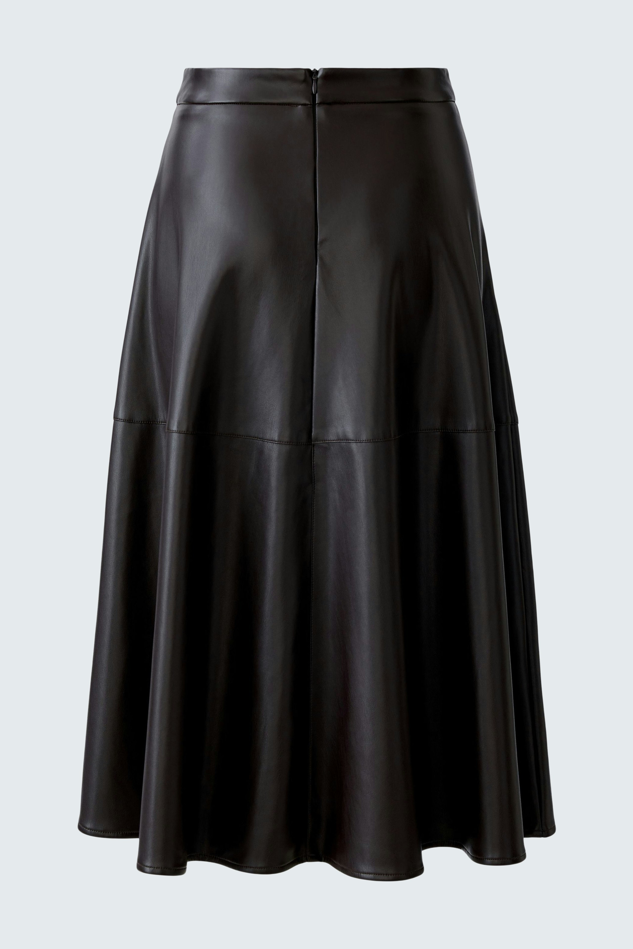 A-line skirt: A woman in a black leather A-line skirt, showcasing a stylish and modern look.