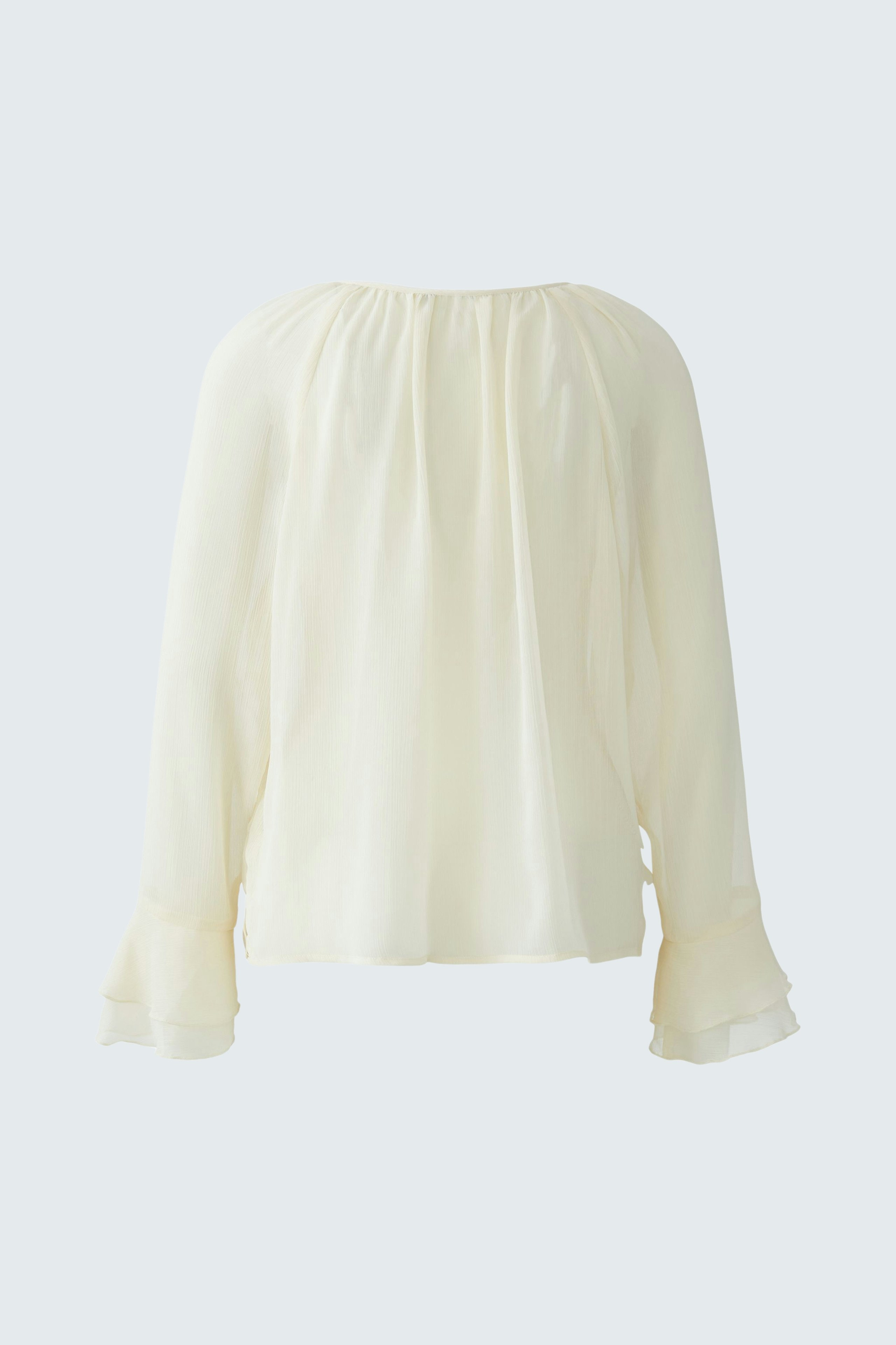 Lightweight women's blouse with flowing sleeves, perfect for casual wear.