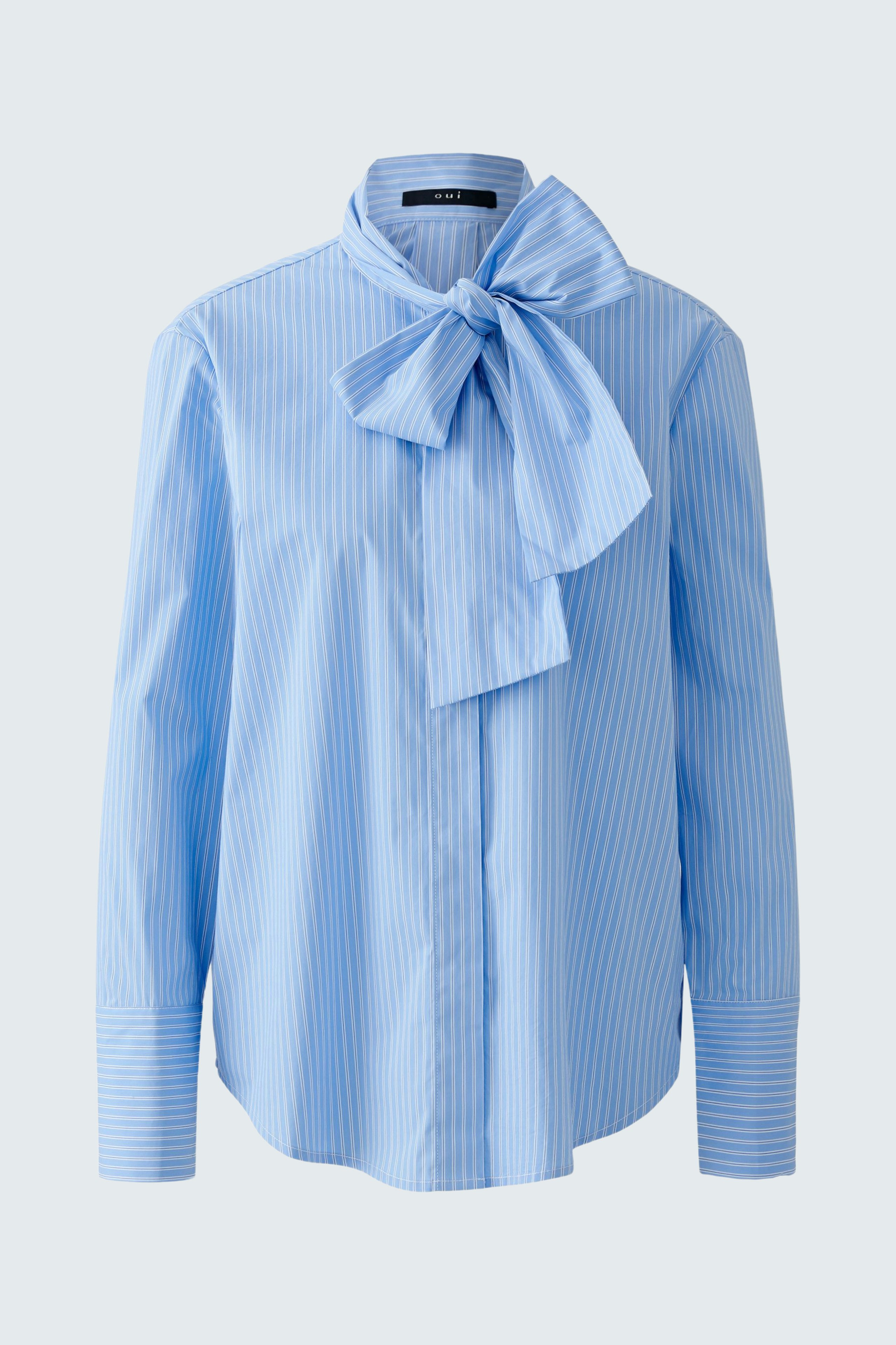 Light blue blouse with a bow tie detail, featuring vertical stripes and a relaxed fit.