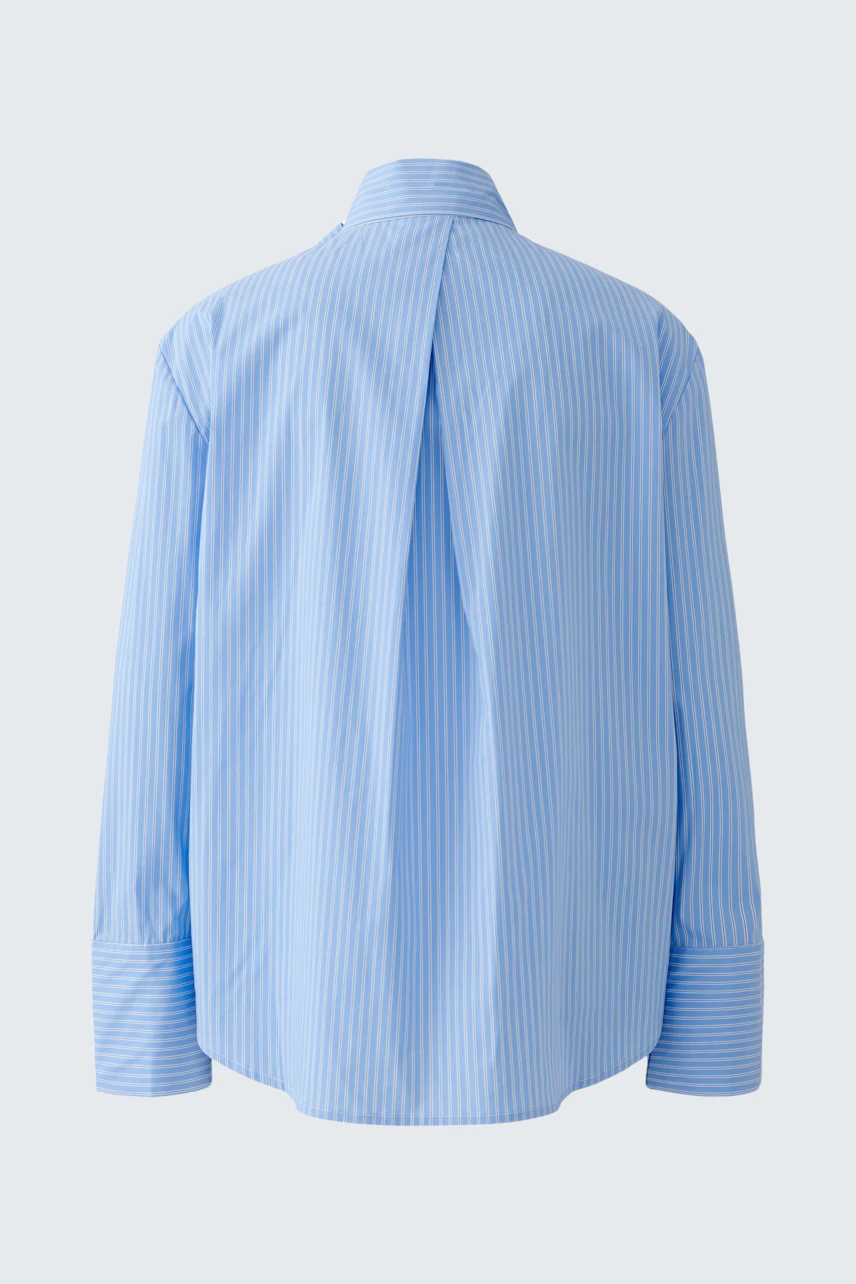 Casual women's blouse: Light blue striped blouse with a relaxed fit and back pleat detail.
