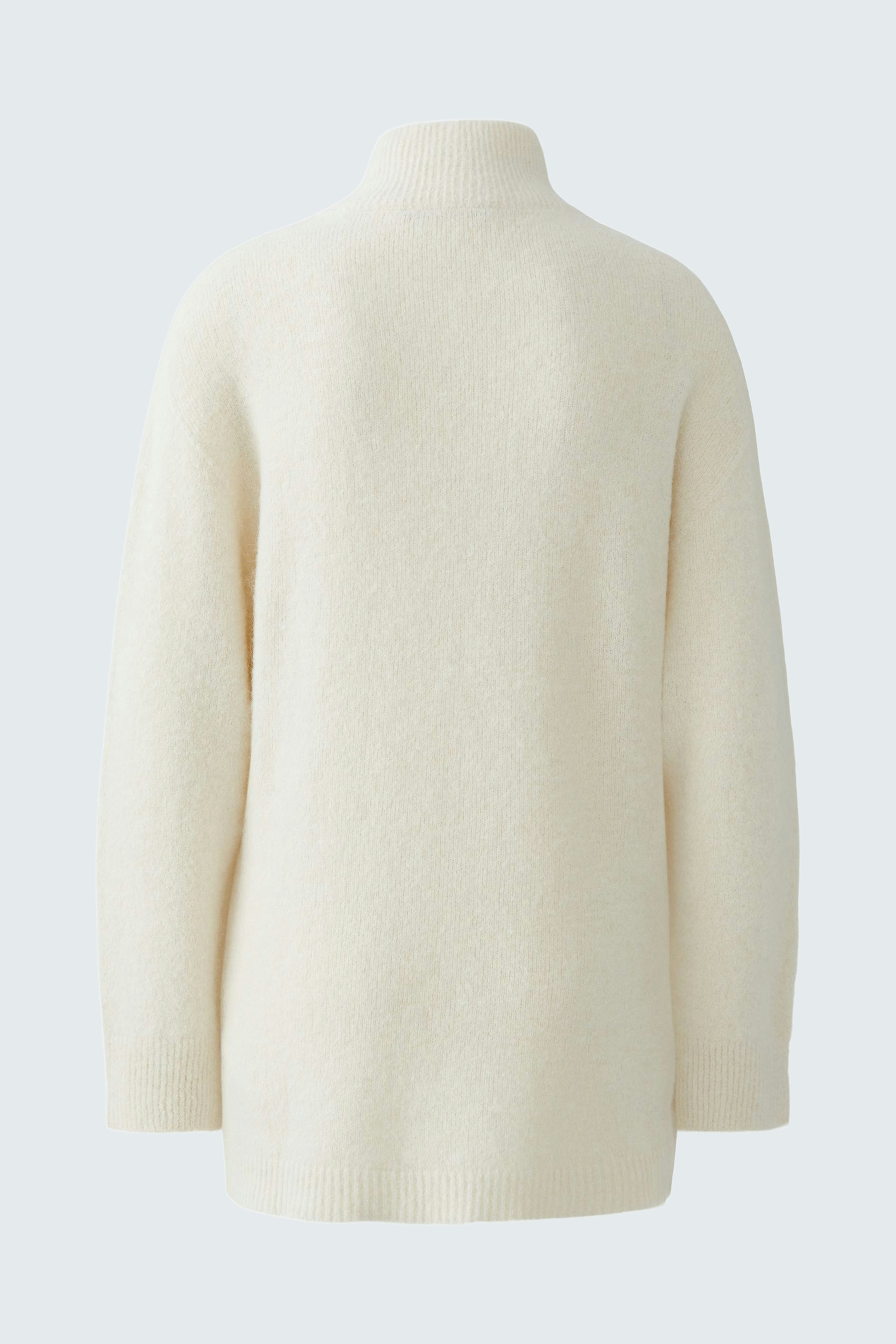 Cozy women's pullover in soft white, featuring a relaxed fit and high collar.