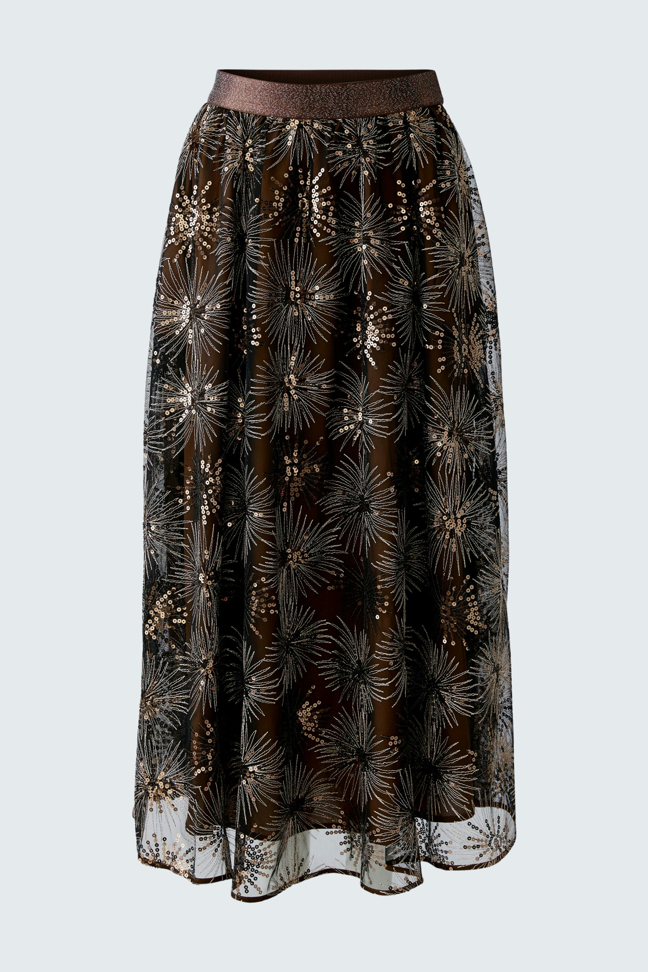 Flowy A-line skirt: A woman in a sheer brown skirt with floral patterns, perfect for casual wear.