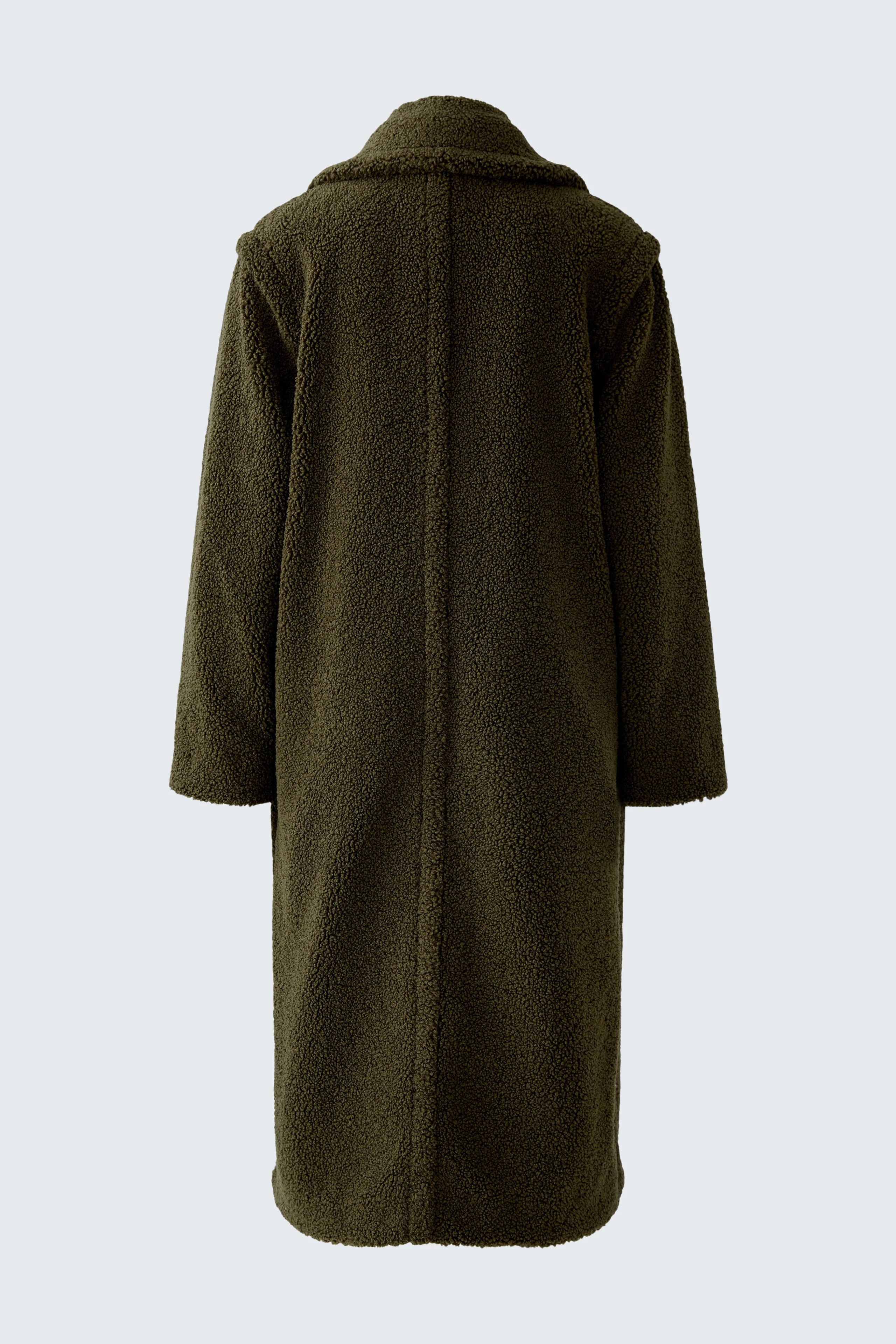 Cozy women's winter coat in dark green, featuring a relaxed fit and soft texture.