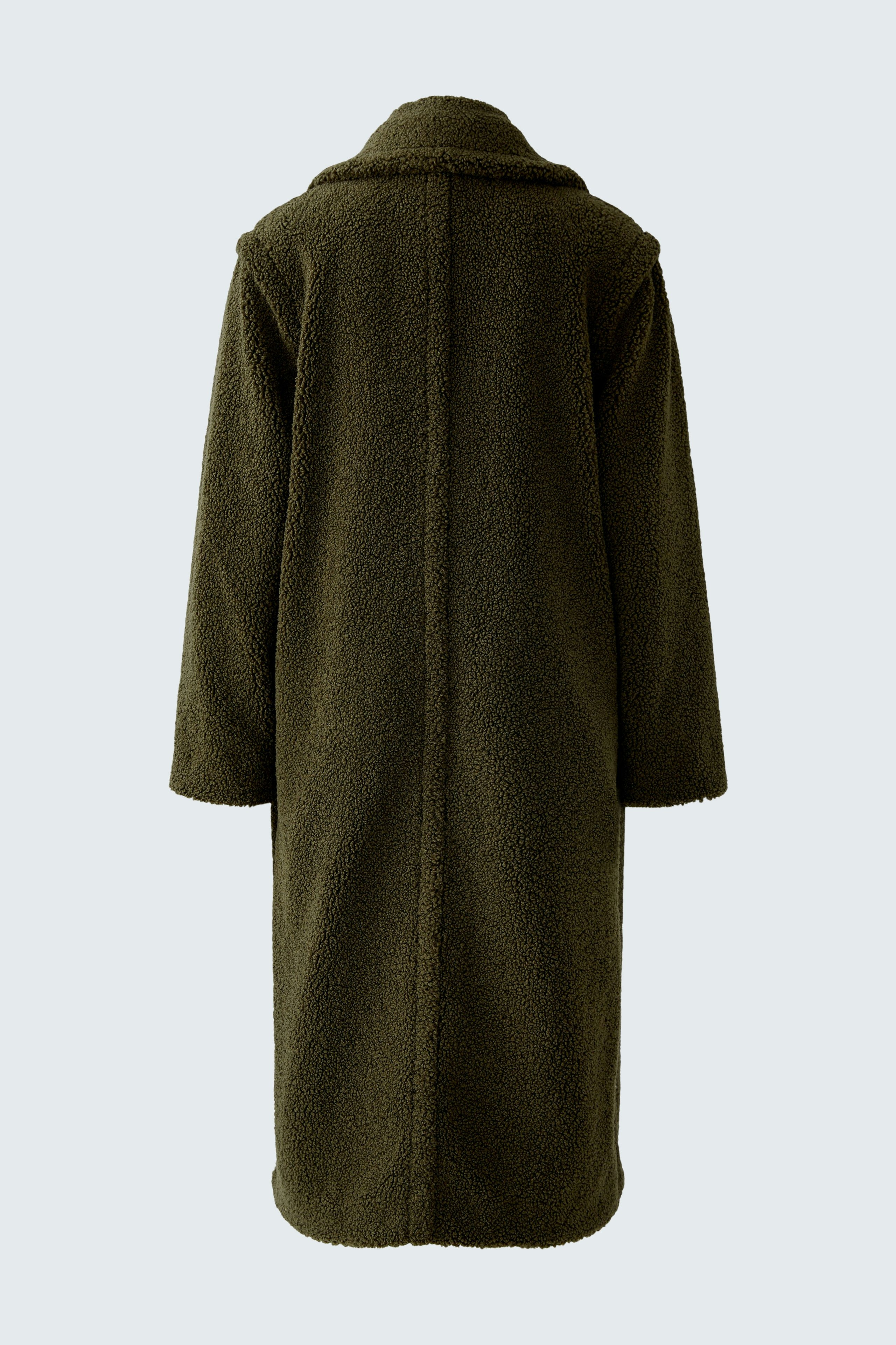 Cozy women's winter coat in dark green, featuring a relaxed fit and soft texture.