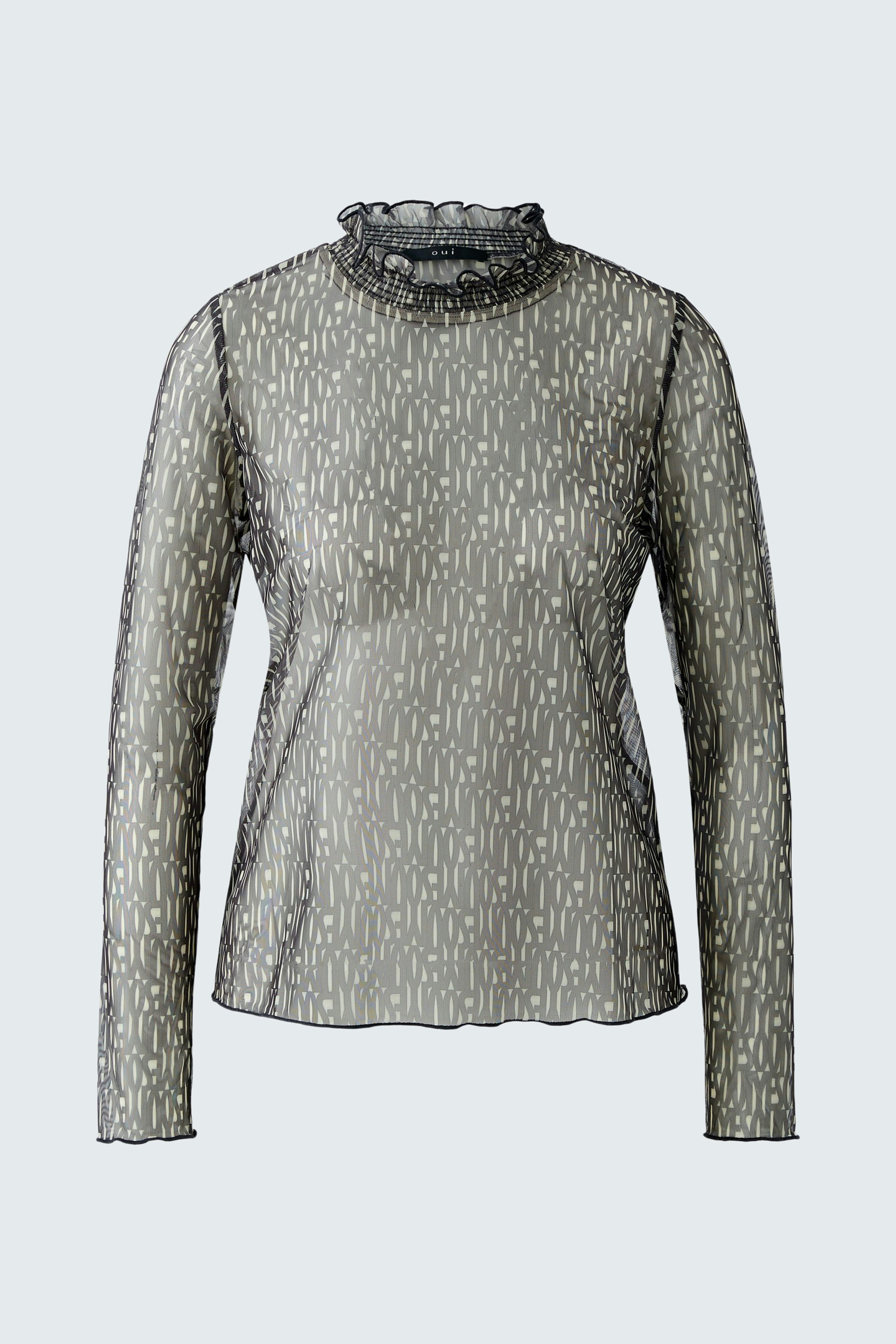 Stylish long-sleeve shirt: A woman in a patterned top with a high neckline, perfect for casual wear.