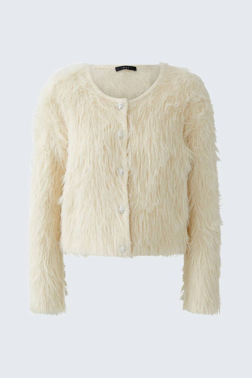 Cozy women's cardigan: A soft, fluffy cream cardigan with buttons, perfect for layering.