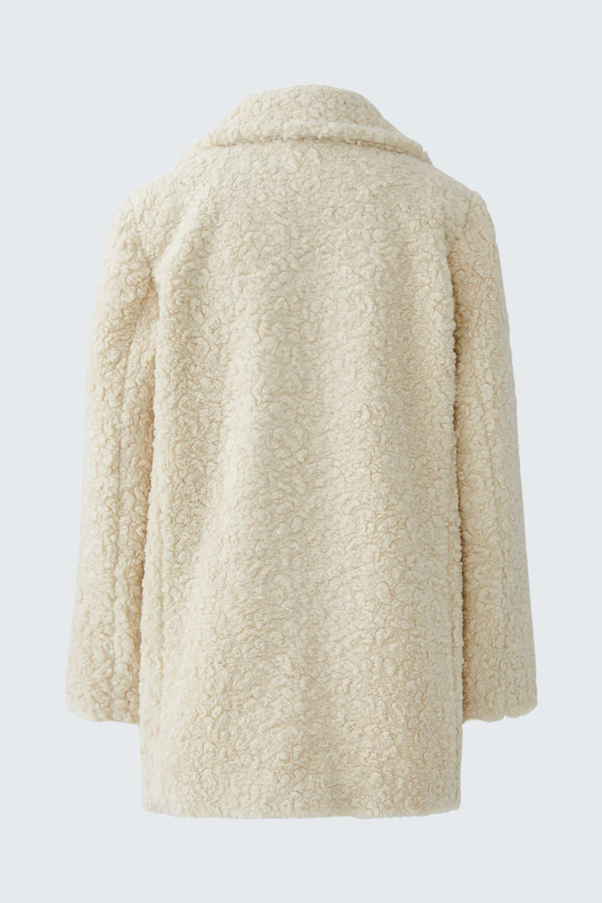 Cozy women's coat: Soft, fluffy design in cream color, perfect for casual layering.