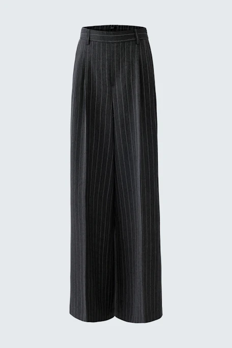 Wide-leg trousers: A woman in stylish, pinstriped trousers, perfect for casual or office wear.