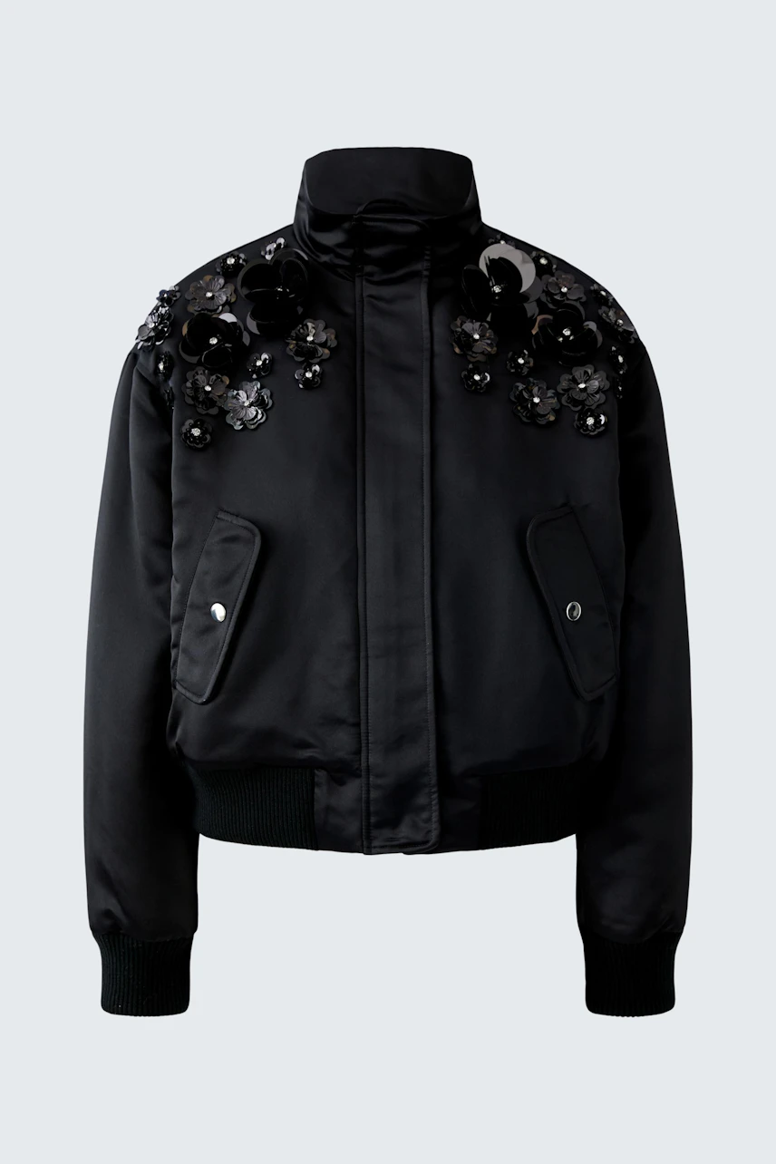 Stylish women's blouson: Black bomber jacket with decorative details, perfect for casual outfits.