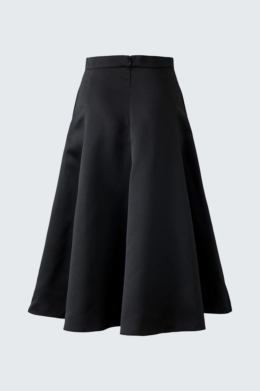 A-line skirt: A black, flowing A-line skirt designed for women, perfect for casual wear.