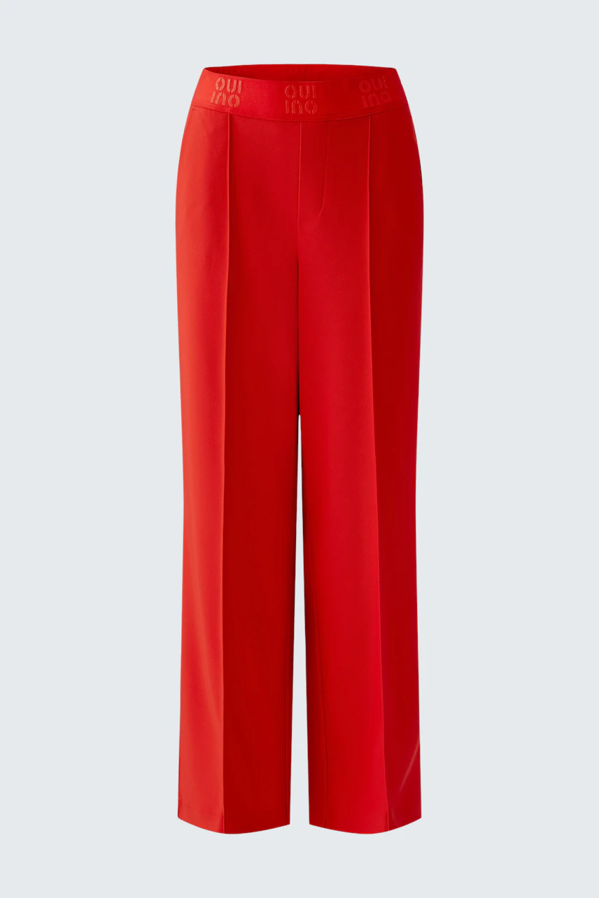 Bright red women's trousers with a comfortable waistband, perfect for casual wear.