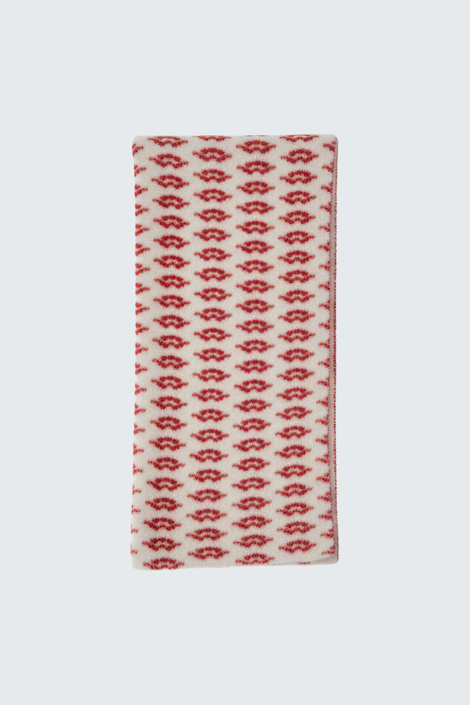 Gemusterter Damen-Schal: Rote und weiße Farben mit verspieltem Design, ideal für kalte Tage.