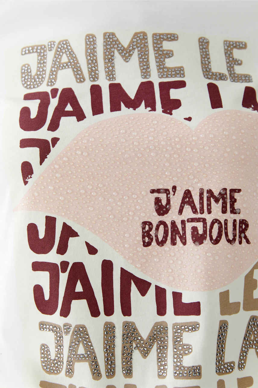 Casual women's T-shirt featuring a playful graphic design with lips and text.