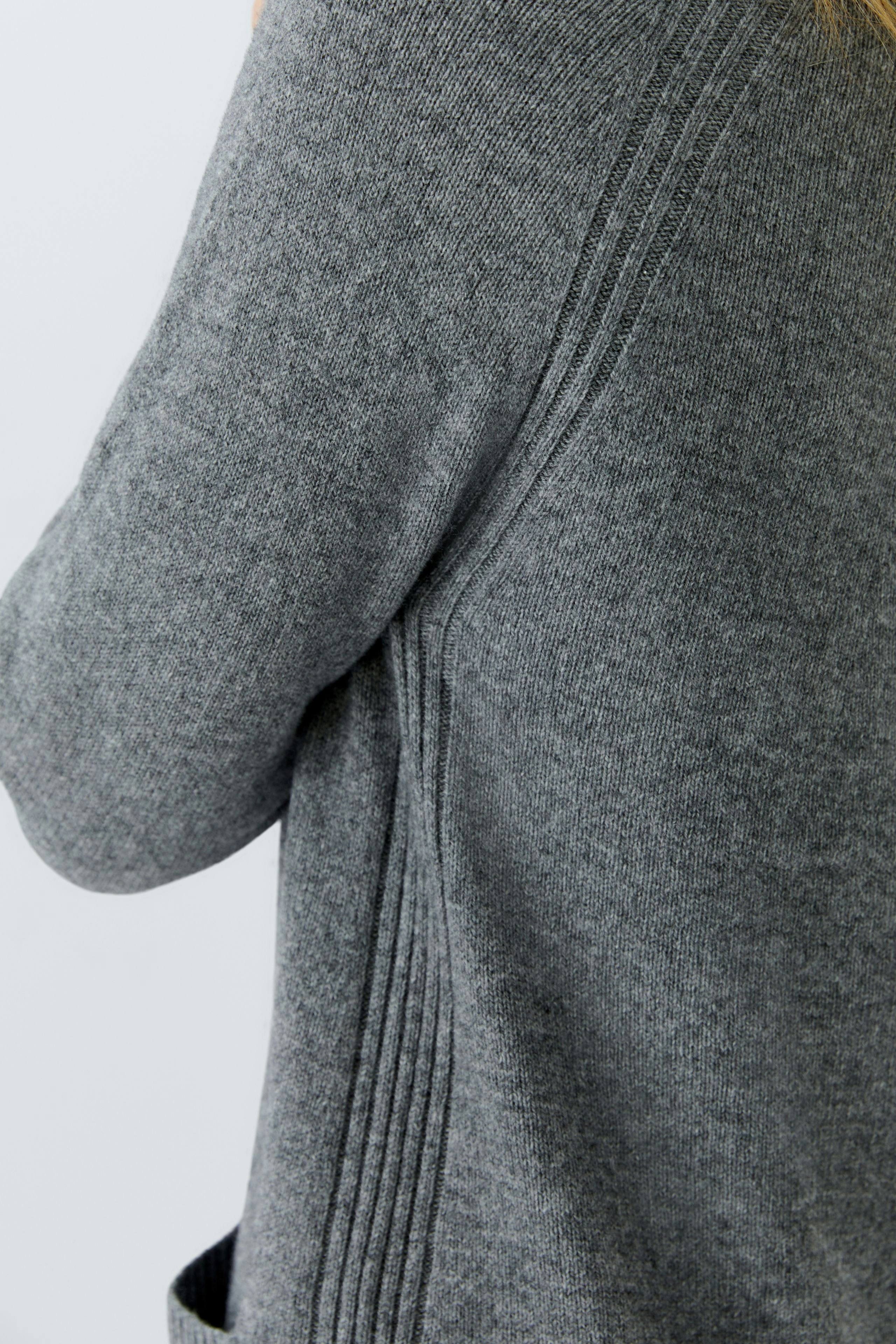 Casual women's knit dress in soft gray with a relaxed fit and stylish ribbed details.