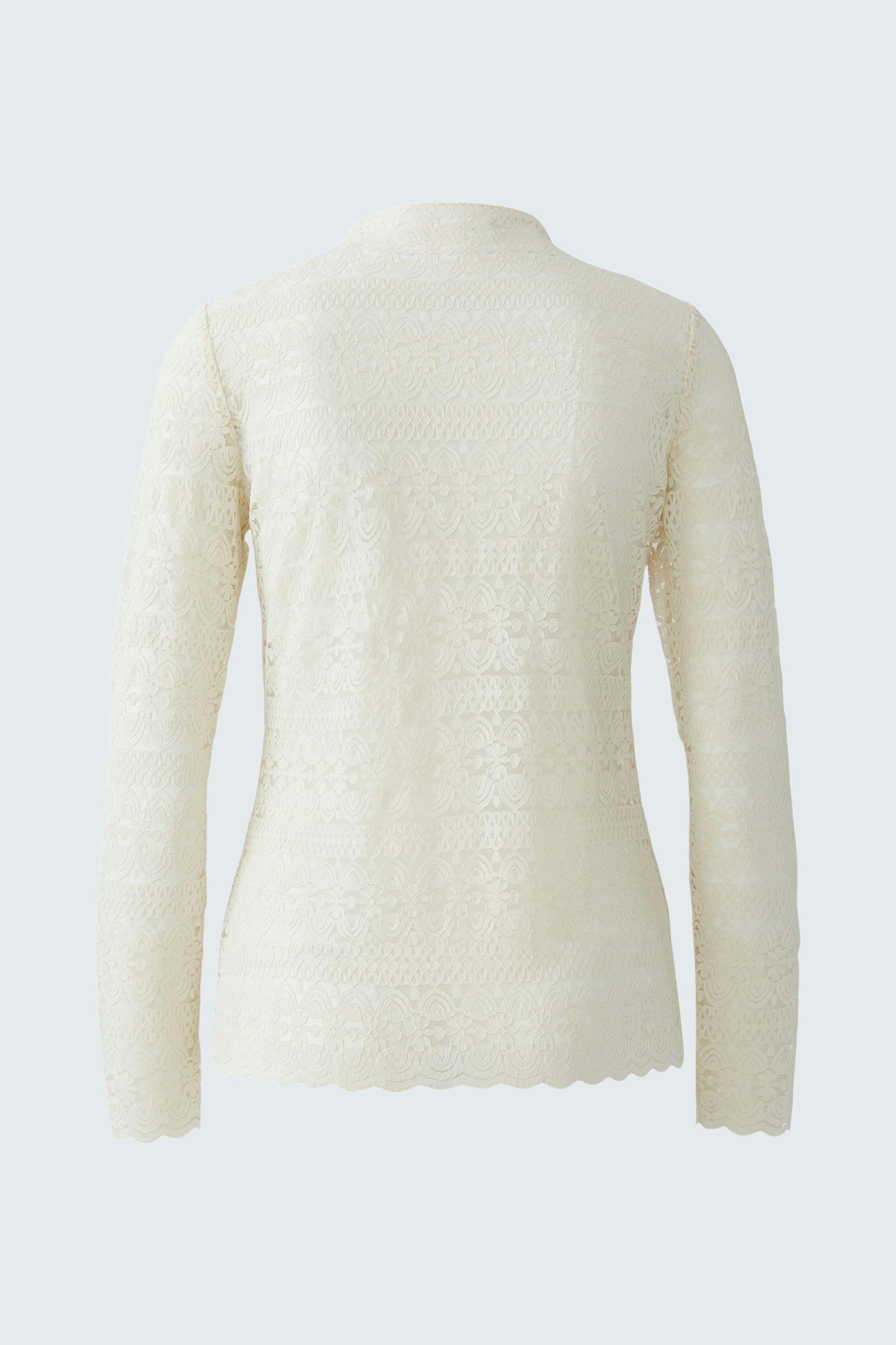 Casual long-sleeve shirt: A woman in a cream-colored pullover with a textured finish, viewed from the back.