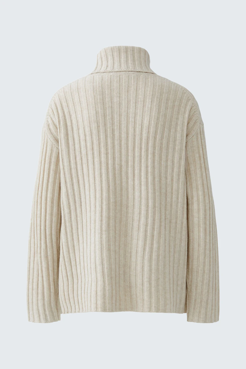 Casual women's pullover: Back view of a cream ribbed pullover with a high collar.