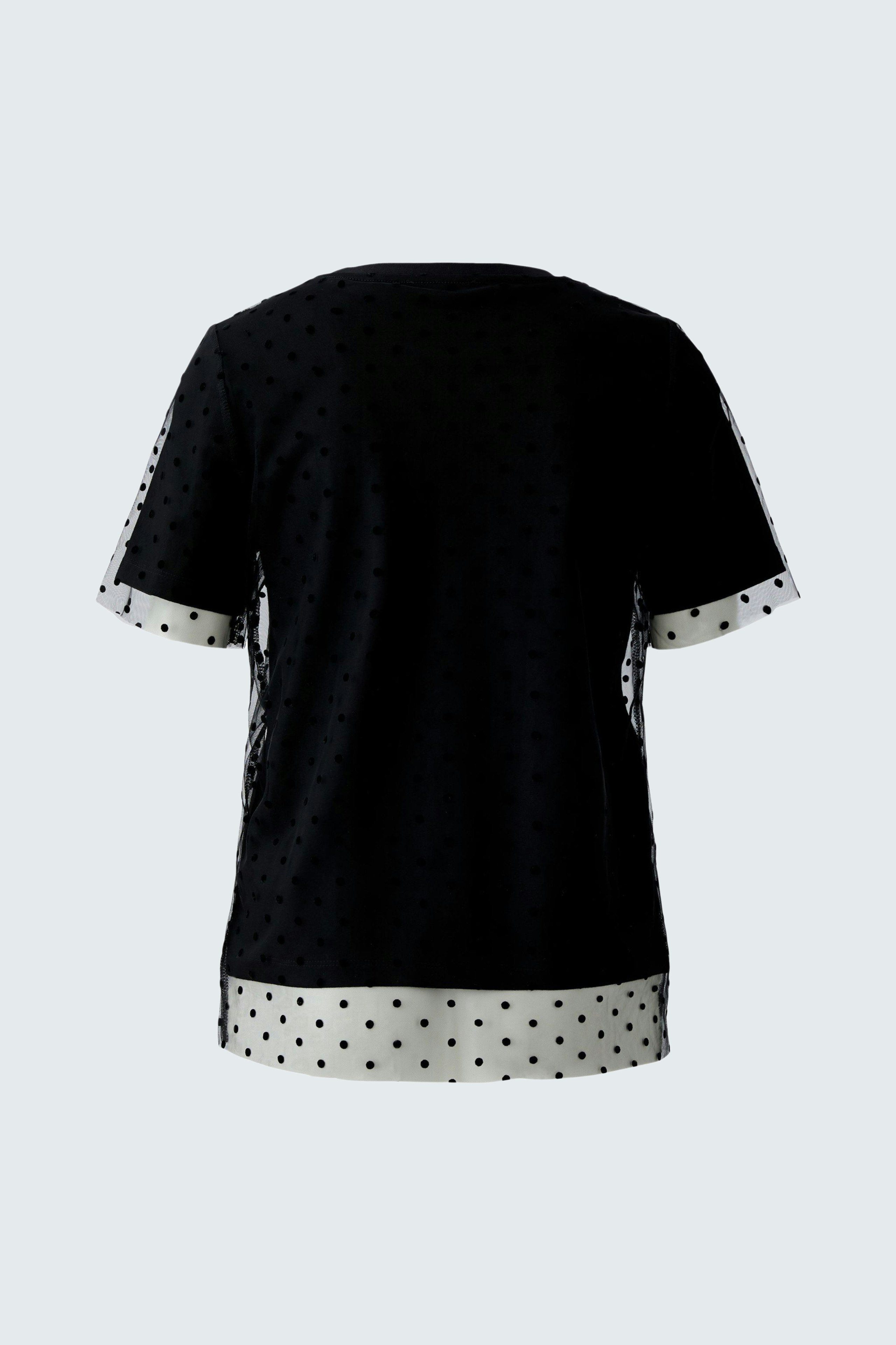 Schwarzes Damen-T-Shirt mit weißen Punkten und kontrastierendem Saum für einen lässigen Look.