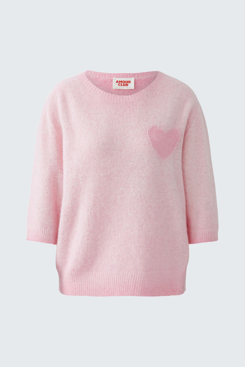 Bequemer Damen-Pullover in zartem Rosa mit Herz-Applikation auf der Brust.