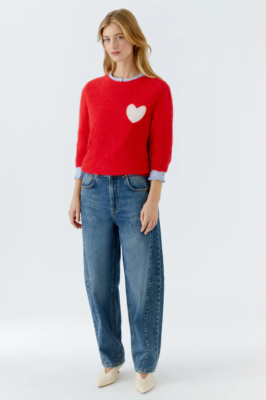 Cozy red pullover with a white heart detail, perfect for casual wear.