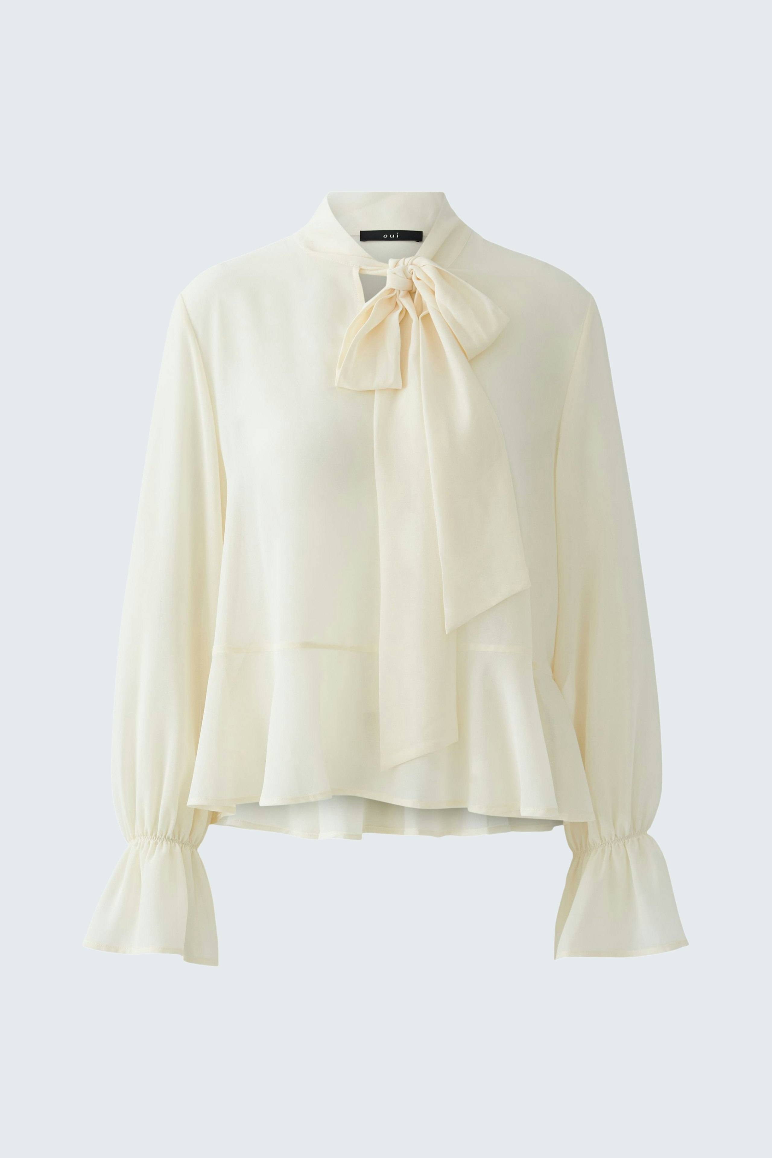 Light cream blouse with a bow tie detail and flared sleeves, designed for women.