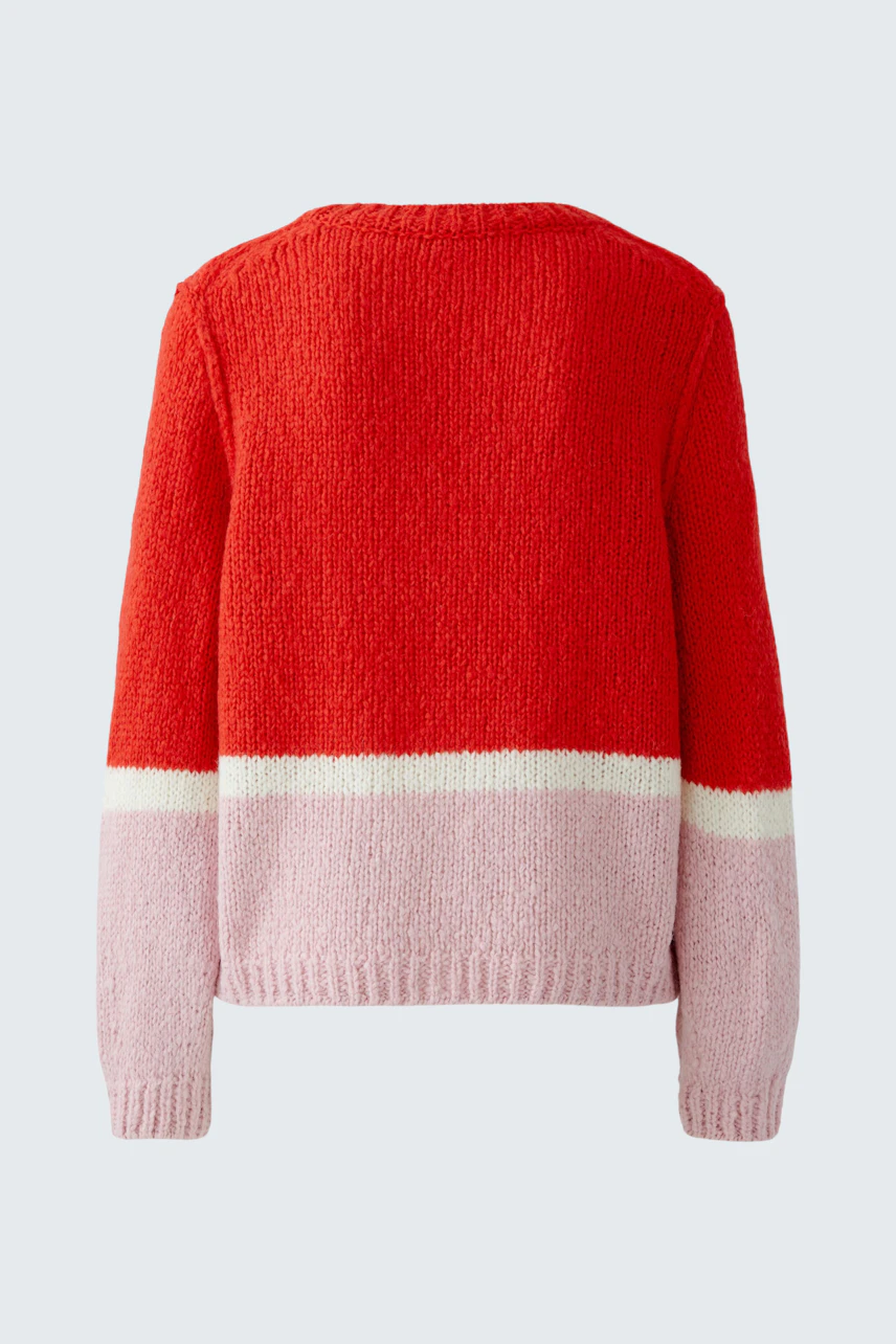 Cozy women's pullover in red and pink with a relaxed fit, perfect for casual wear.