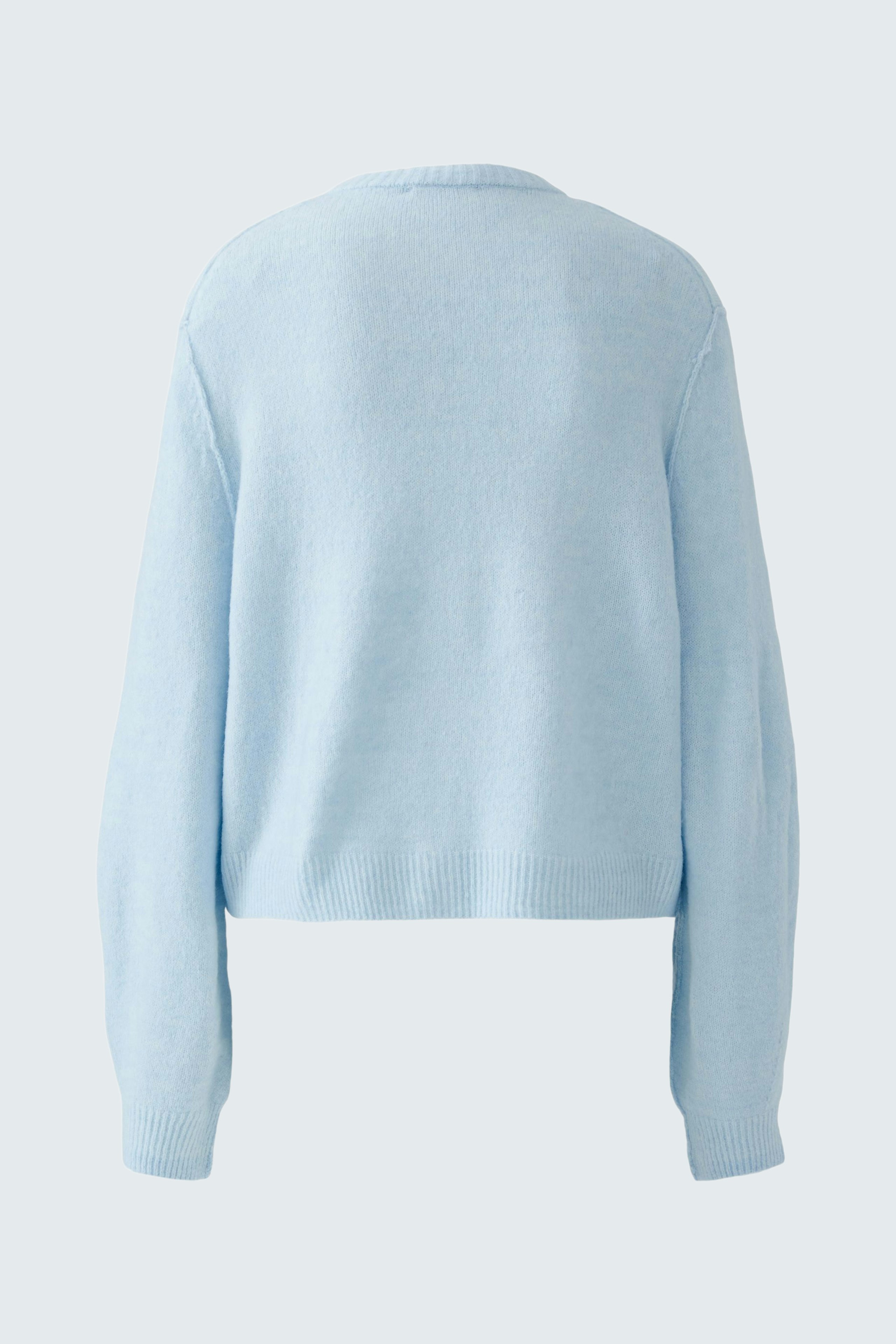 Casual women's cardigan in soft light blue, featuring a relaxed fit and long sleeves.