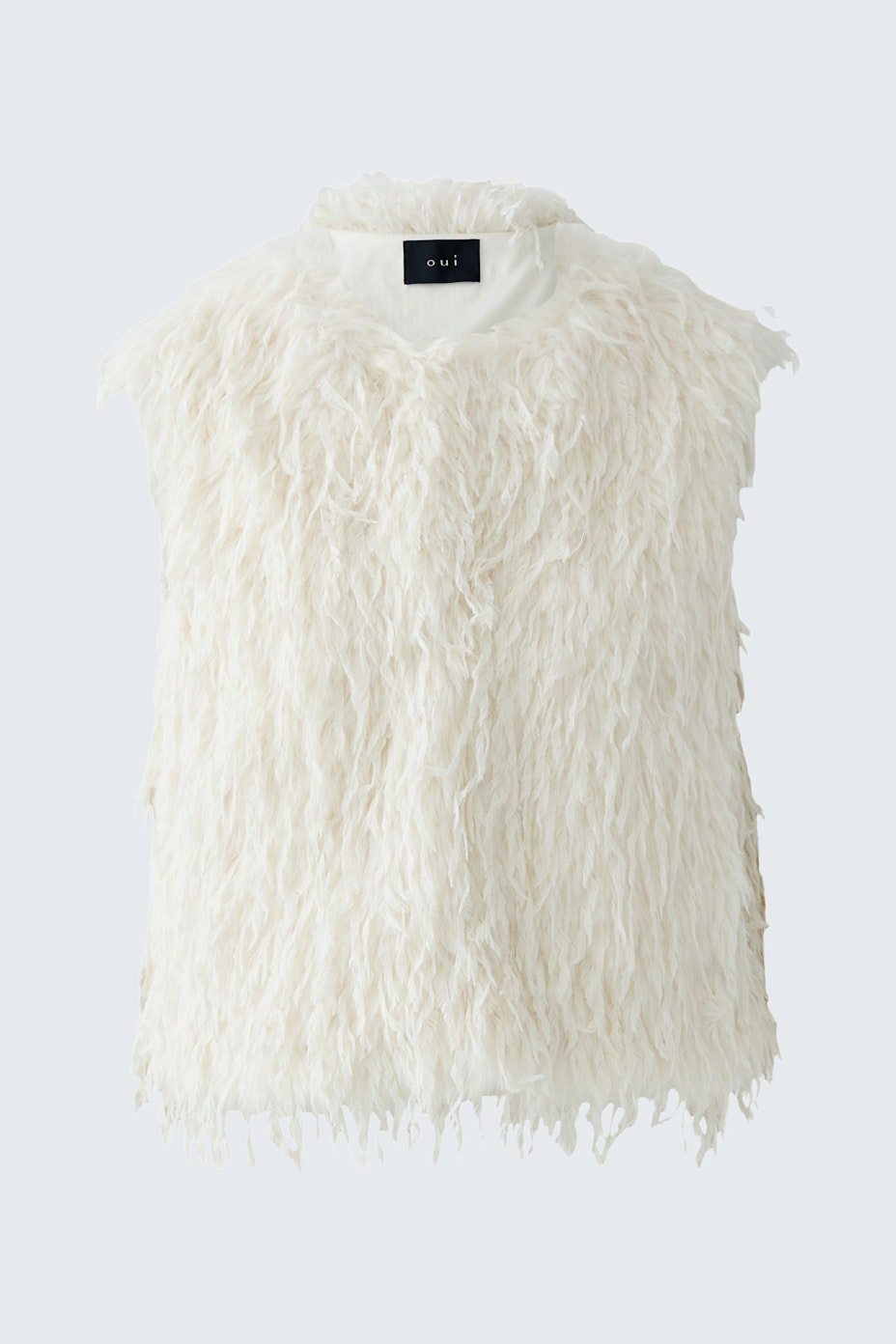 Fuzzy white vest: A stylish women's vest with a soft texture, perfect for layering.