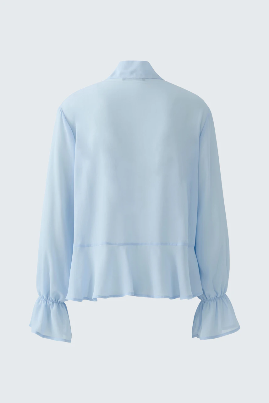 Helle Damen-Bluse mit Rüschendetails und lockerer Passform, ideal für den Alltag.