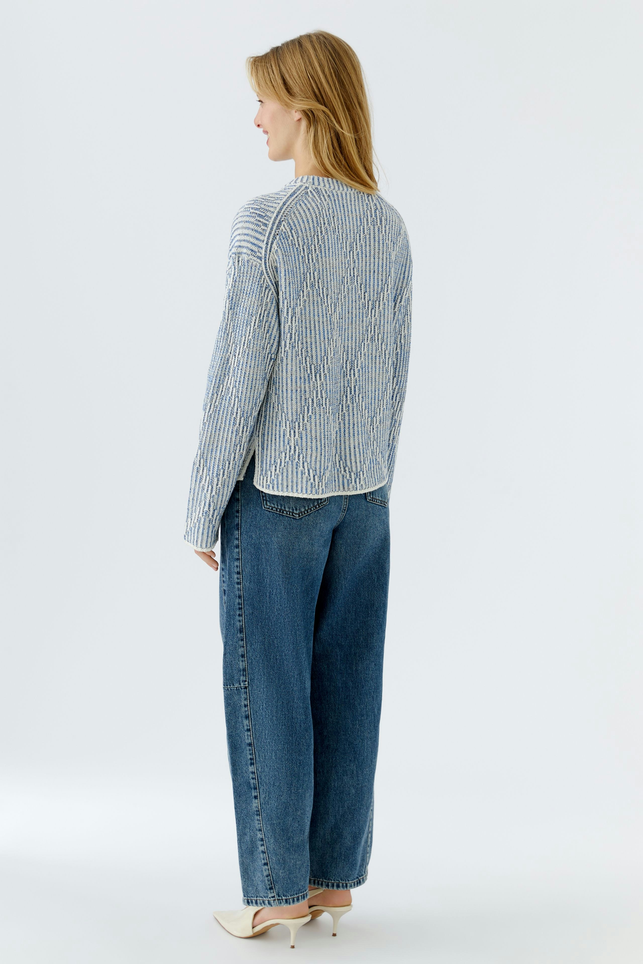 Casual women's pullover: A woman in a striped pullover with a relaxed fit and back view.